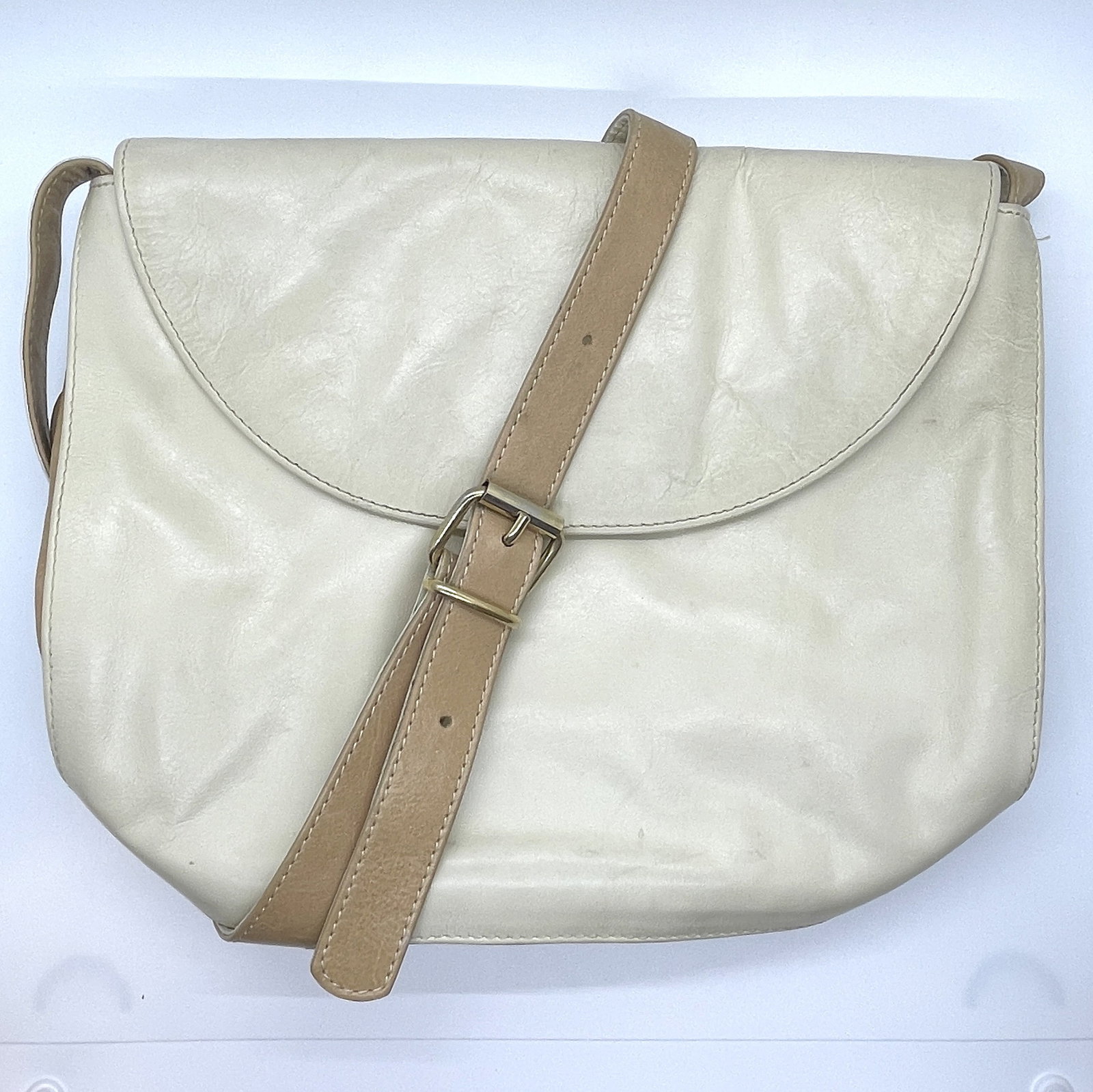 Creed 2 Tone Cream Beige Leather Bag: Made in Italy for Creed. 2 tone beige/tan and ivory/cream. 10.5" x 8.5" x 3" with 22" adjustable strap drop. Fully lined. In vintage conditino with stains and imperfections.