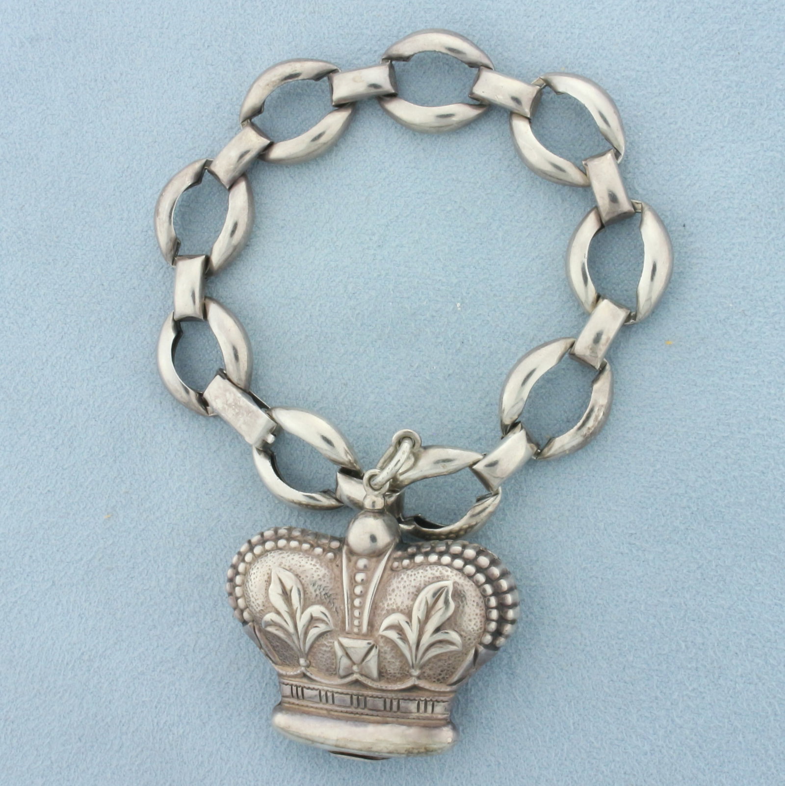 Vintage Danecraft Royal Crown Charm Bracelet in .925 Sterling Silver: In .925 Sterling Silver. 7 inches long, links are 1/2 inches wide. Puffy detailed crown in 1 3/8inches wide by 1 3/8 inches long. 24.5g.