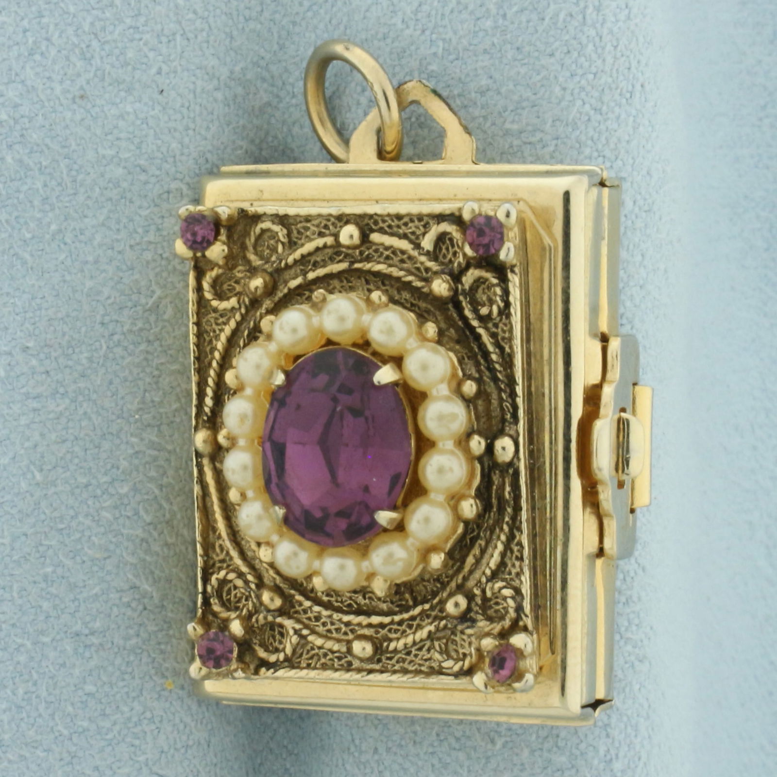 Vintage Coro 4-Way Picture Frame Locket: Gold plated. Contains a high quality natural 3ct Amethyst gemstone with intense color and seed pearls. 1 inch long x 3/4 inches wide. Expands to 3 inches long.