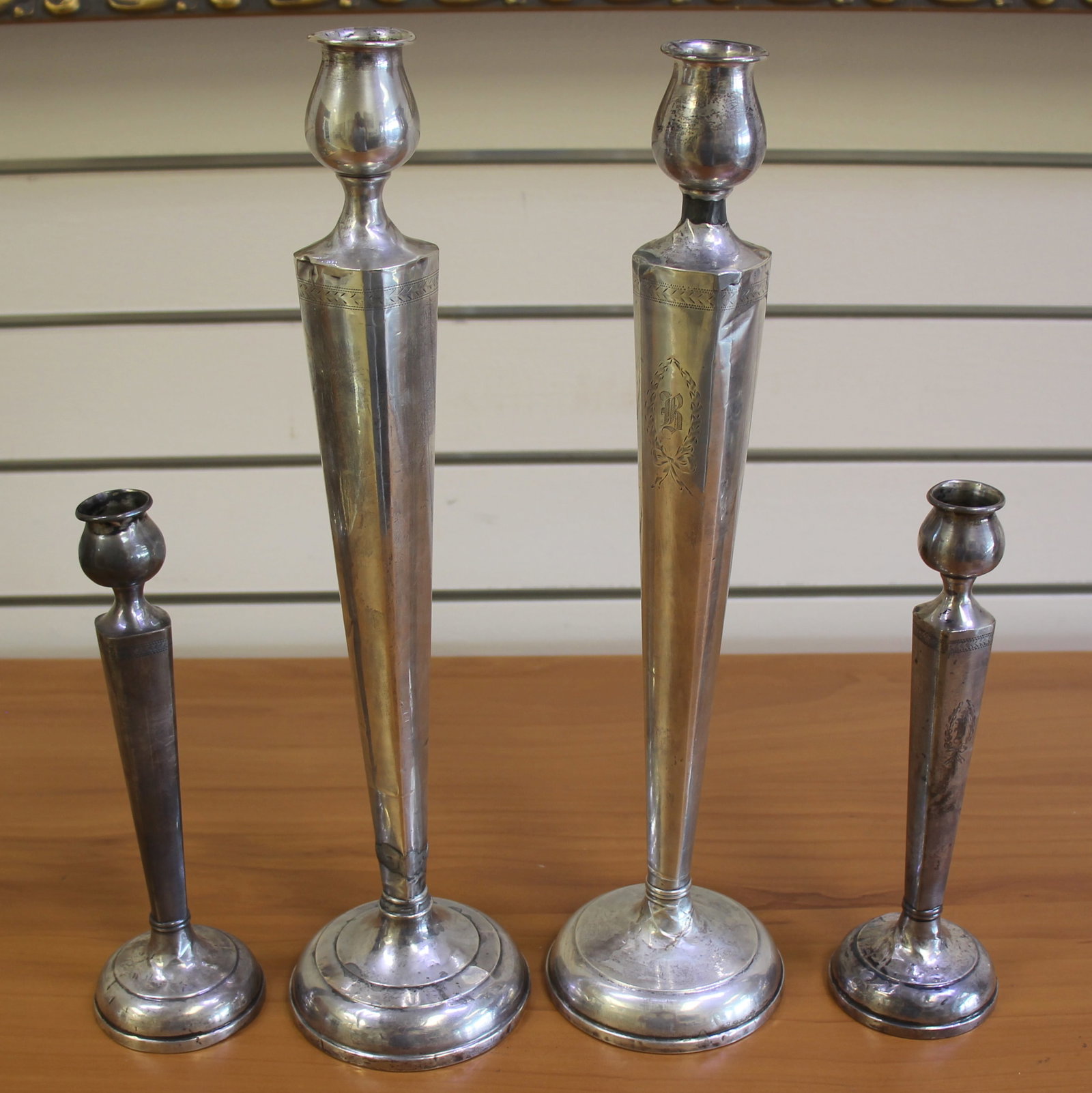 Antique Victorian Wreath Set of 4 Candlestick holders in .925 Sterling Silver.: In .925 Sterling Silver, weighted. Hand engraved with laurel wreath, "B", pattern around top. Includes 2 sticks 13 1/2 inches tall, and 2 sticks 8 3/4 inches tall. Repairs and imperfections consistent