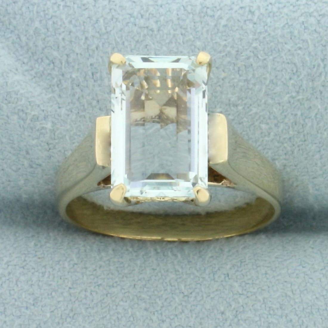 3CT Emerald Cut Aquamarine Solitaire Ring in 14k Yellow Gold: In 14k yellow gold. Contains one 3ct high quality natural Emerald Cut Aquamarine gemstone with bright color and excellent clarity. Size: 7.25. 5.4g.