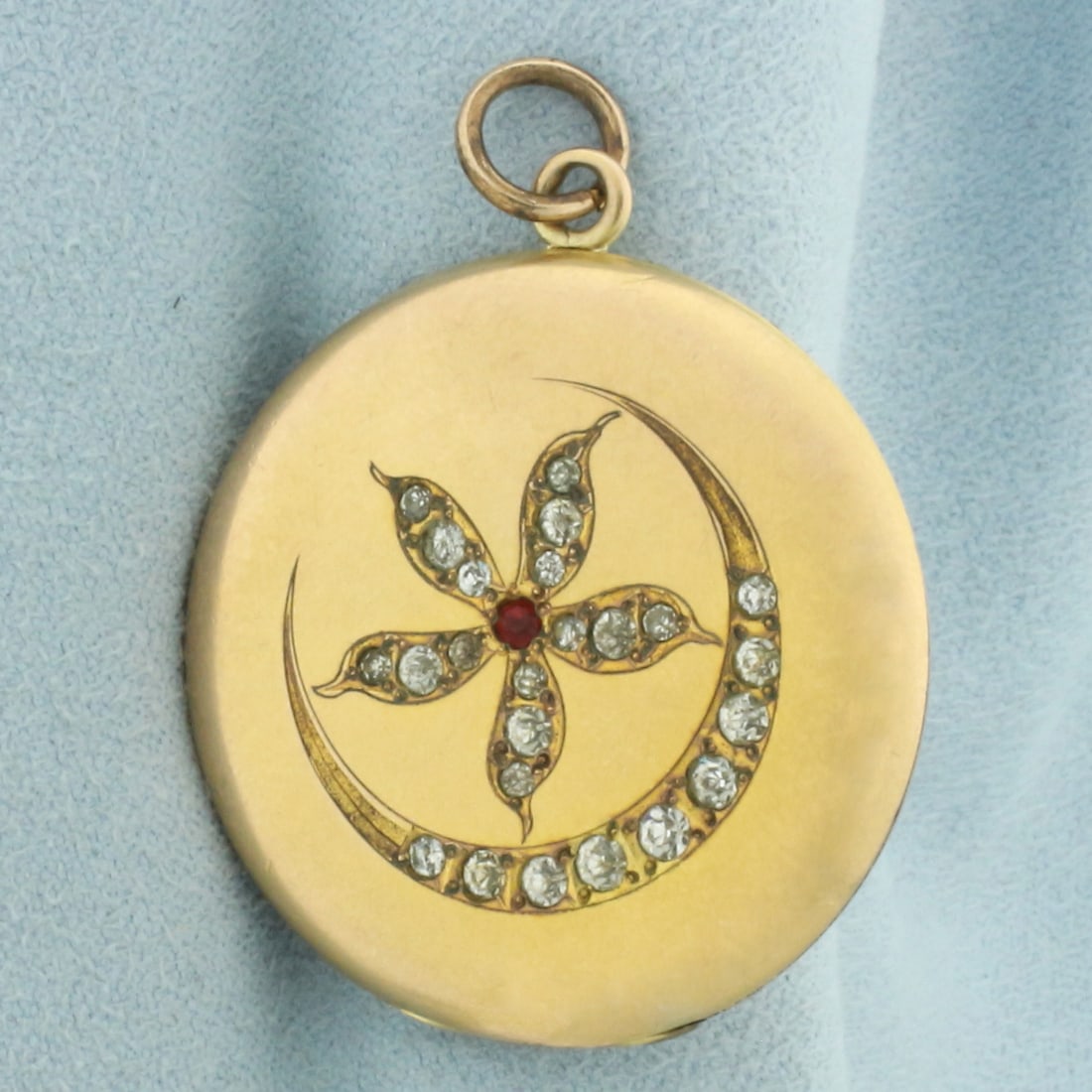 Antique Victorian Gold Filled Flower Crescent Moon Locket: Gold filled. 1 1/8 inch diameter. Antique hand engraved initials on back. Slight indentations consistent with age. Opens to 2 sides for photos or keepsakes with frame bezels included.