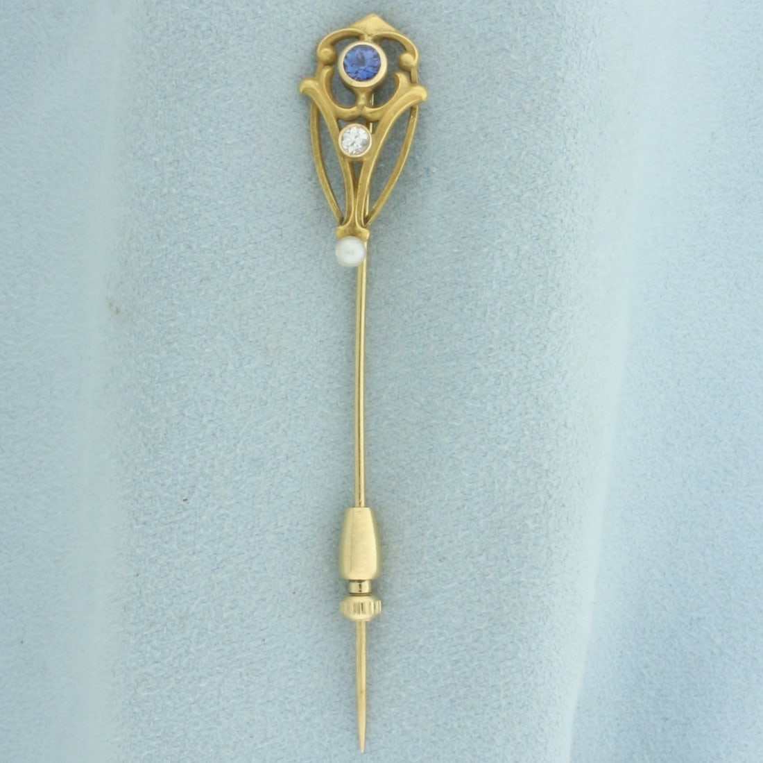 Antique Sapphire, Diamond, and Pearl Stick Pin in 14k Yellow Gold: In 14k yellow gold. Contains one high quality natural .15ct Sapphire gemstone with vibrant color and excellent clarity. Also contains one .05ct high quality diamond, VS clarity/G color. Also contains 