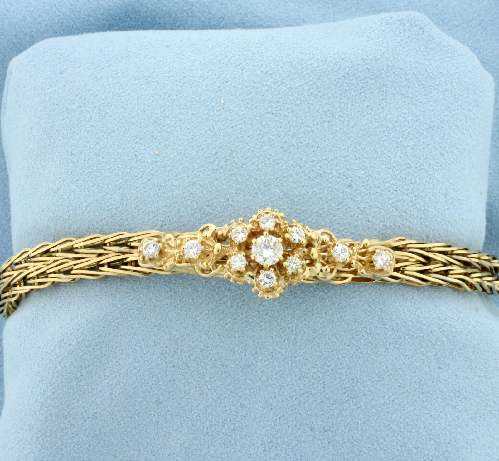 Vintage Designer Diamond Link Bracelet in 14k Yellow Gold: In 14k yellow gold. Contains one 1/3ct and ten 1/10ct high quality diamonds, SI clarity/H color. 7 1/2 inches long. Safety clasp with safety chain. 21.1g.