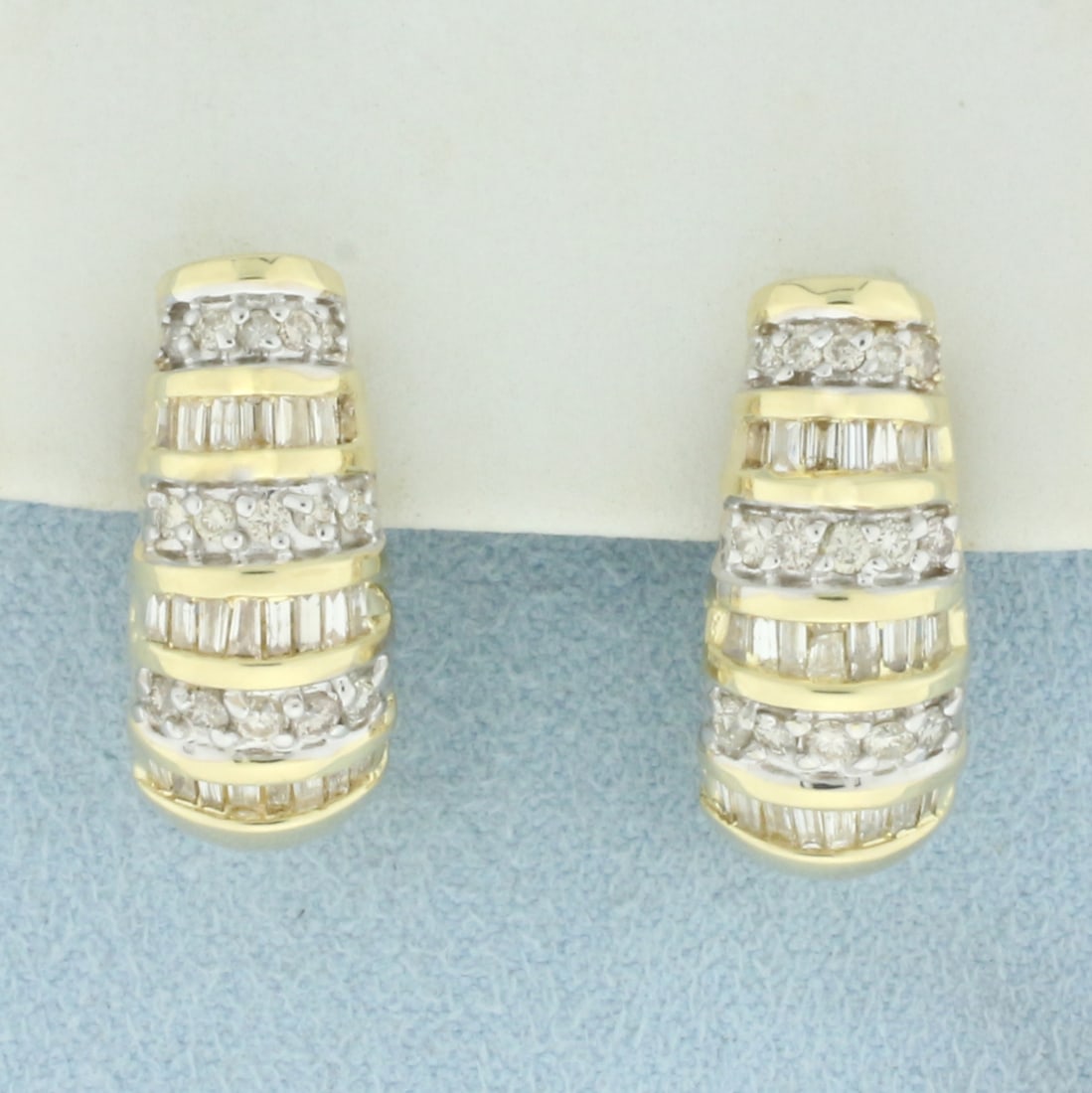 Diamond Beehive Design Half Hoop Earrings in 14k Yellow Gold: In 14k yellow gold. Contains 30 round brilliant and 46 baguette high quality diamonds, 1/2ct TW, SI clarity/I color 7/8 inches long x 1/4 inches wide. Omega post backs for pierced ears. 9.0g.