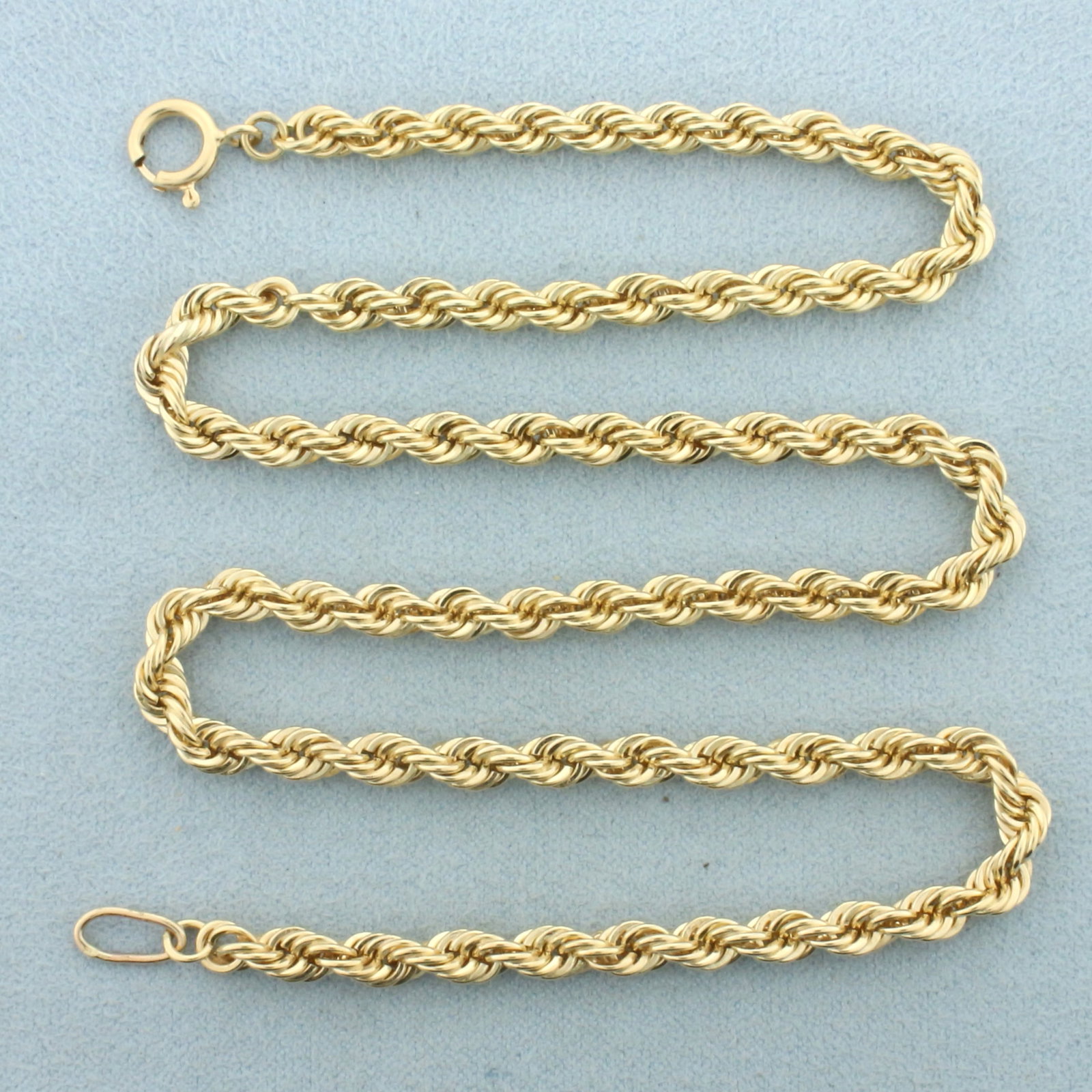 16 Inch Rope Link Chain Necklace in 14k Yellow Gold: In 14k yellow gold. Solid links. 16 inches long. 4mm thick. Spring clasp. 22.6g.