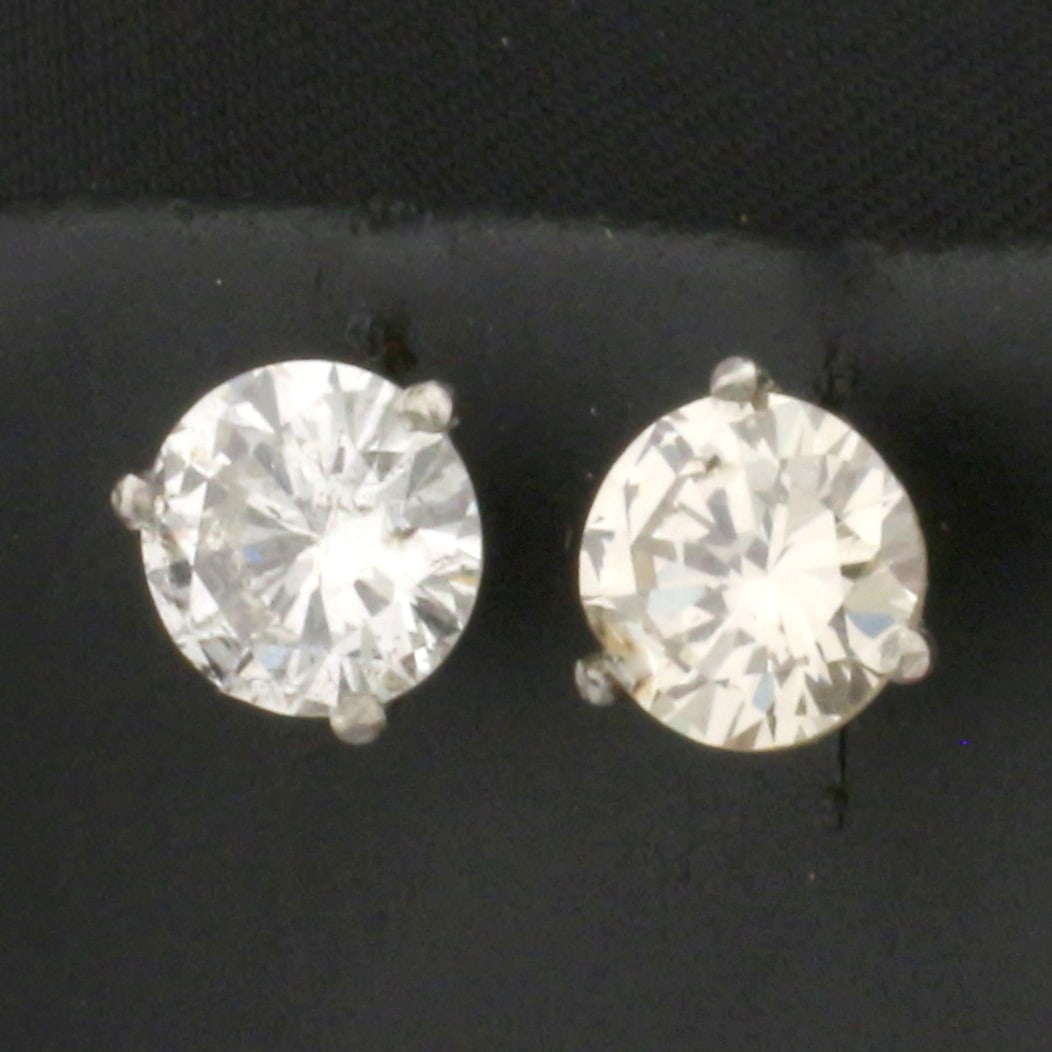 Almost 2.5ct TW Diamond Stud Earrings In Platinum Martini Settings: In platinum martini settings. Contains two high quality round brilliant diamonds, 2.4ct TW, I clarity/H color, great cuts for lots of sparkle. 1.1g