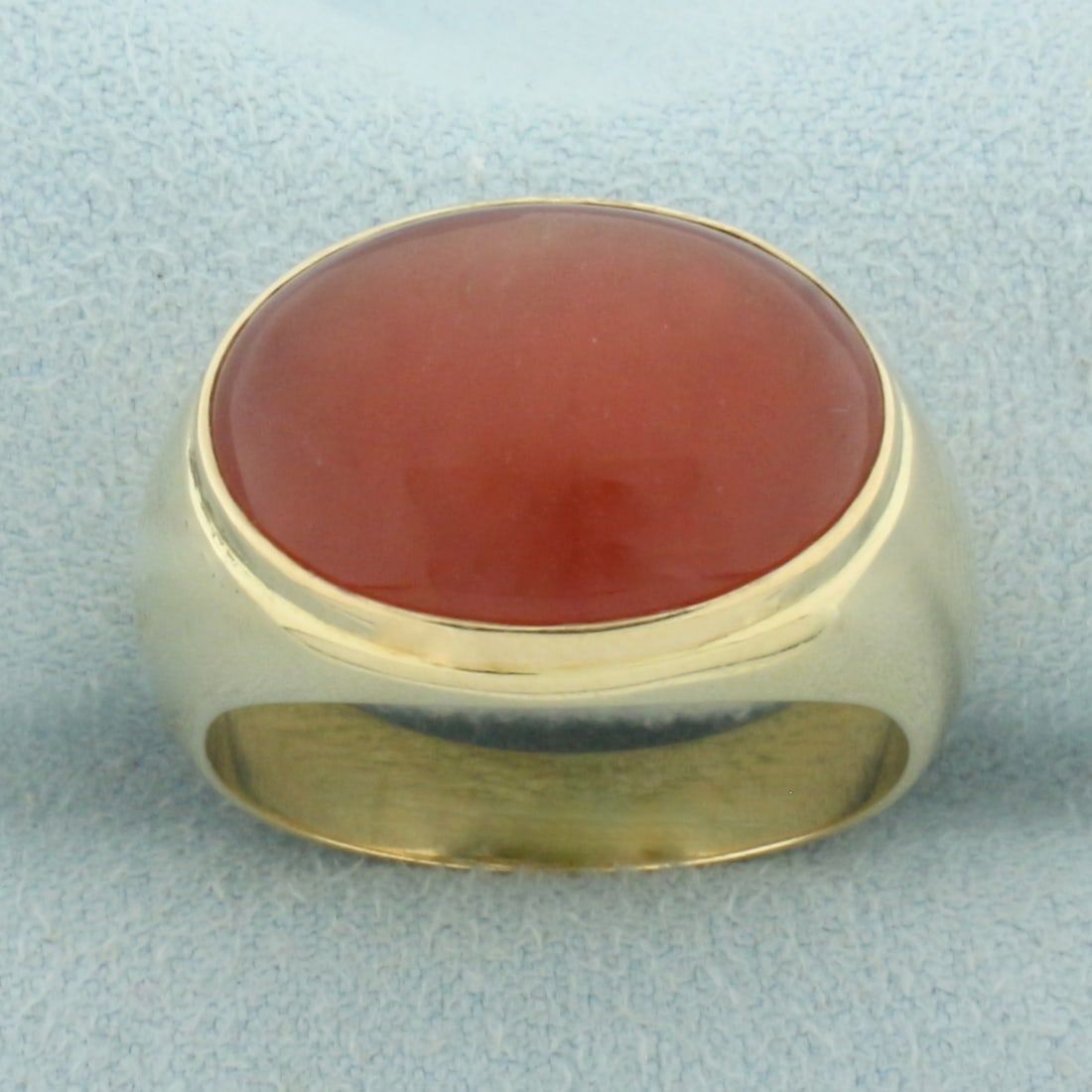 Mens Carnelian Saddle Ring in 14k Yellow Gold: In 14k yellow gold. Contains 1 high quality natural carnelian gemstone, 18.5mmx13mm, with intense orange color Size: 10.