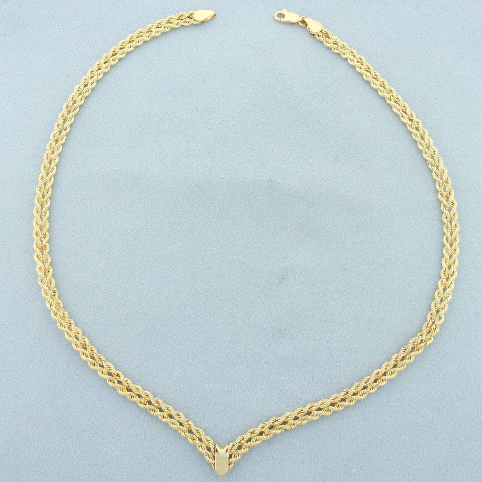 Designer Double Rope Link Chain Necklace in 14k Yellow Gold: In 14k yellow gold. 17 inches long and 5.25mm wide. Chain comes to a "V" at bottom for unique look. Lobster clasp. 8.0g.