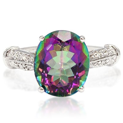 4.5CT Mystic Topaz & Diamond Ring in Platinum over Sterling Silver: Contains a 4.5CT oval cut mystic topaz gemstone accented with .01ctw genuine diamond. Set in Platinum over Sterling Silver. Size 7. 3.5g