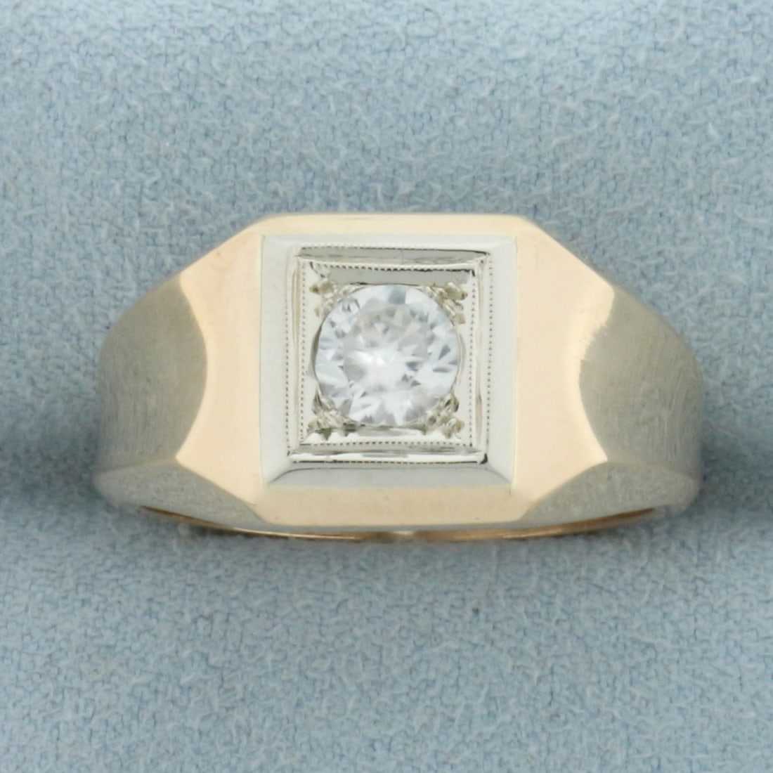 Mens CZ Solitaire Statement Ring in 14k Yellow Gold: In 14k yellow gold. Contains one high quality 2/3ct CZ gemstone with excellent cut and clarity for added brilliance. Milgrain detail. Size:10. 6.7g.