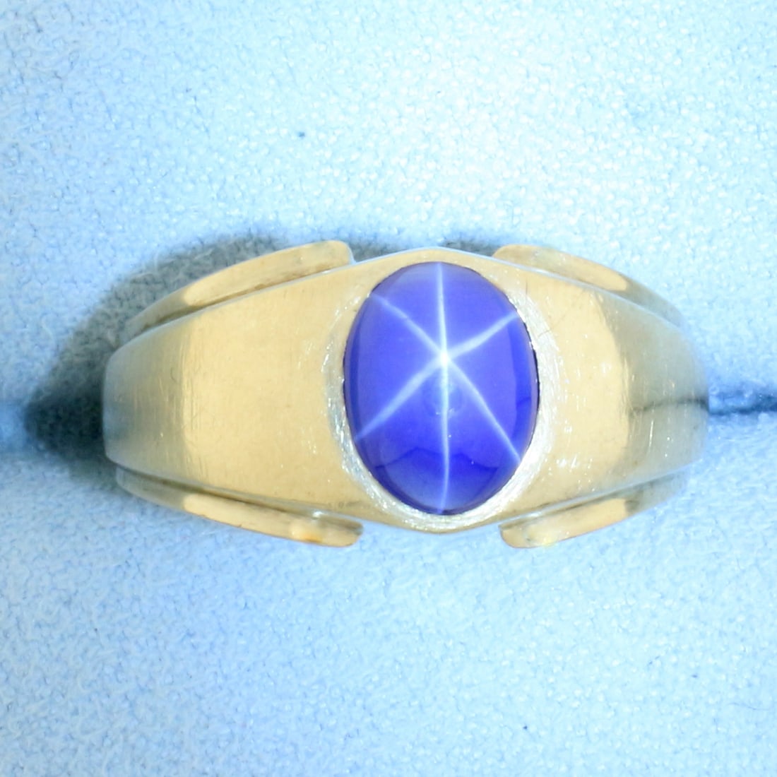 Mens Star Sapphire Ring in 10k Yellow Gold: In 10k yellow gold. Contains 1 high quality 9mm by 7mm star sapphire gemstone with very distinct "star" under light. Size: 9.5. 6.1g.