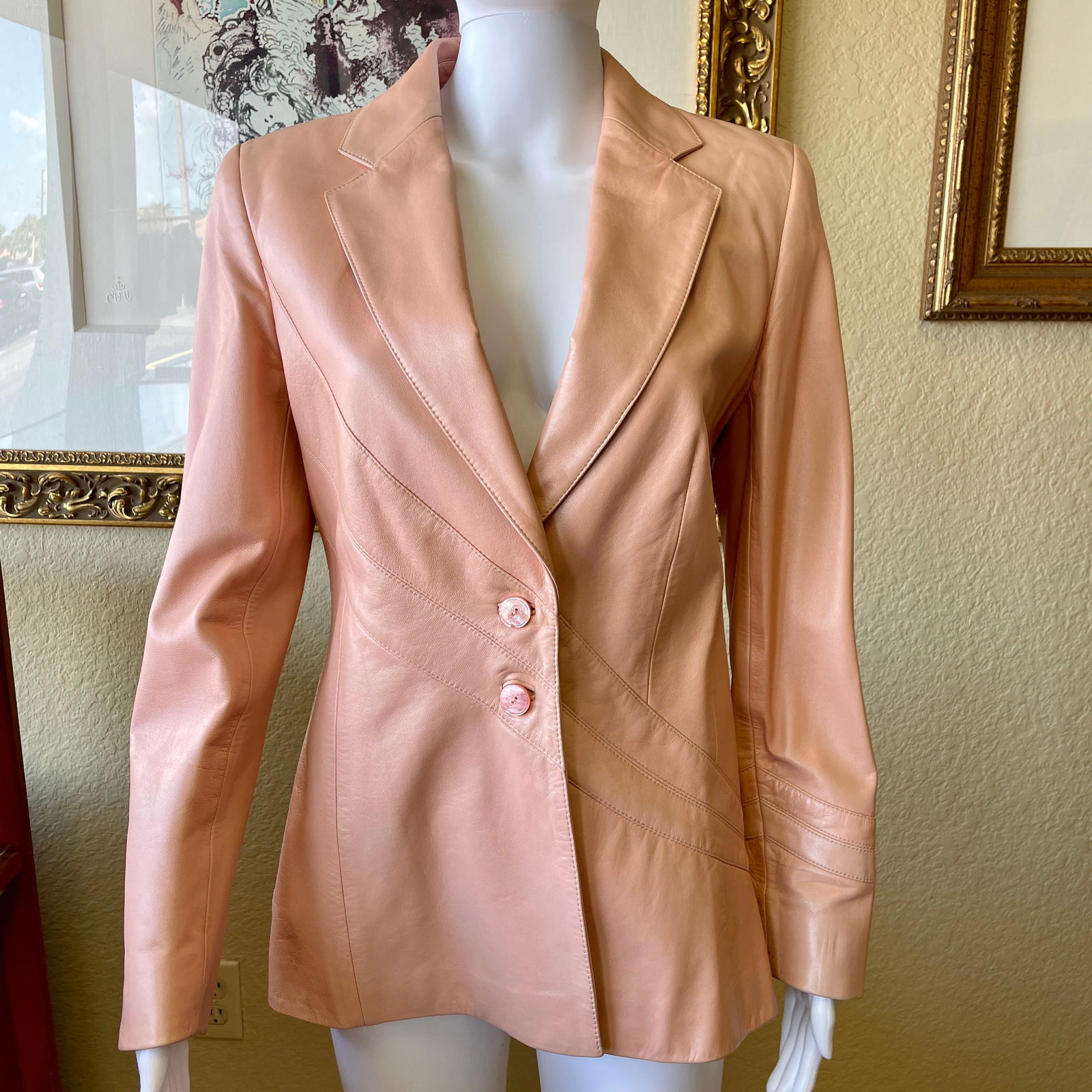 Escada Pink Lambskin Leather Blazer Jacket 38: Escada soft pink lambskin leather blazer with intricate diagonal swoop design. Iridescent tonal pink buttons with Escada signature logo. Fully lined with Escada signature logo fabric. Original receipt