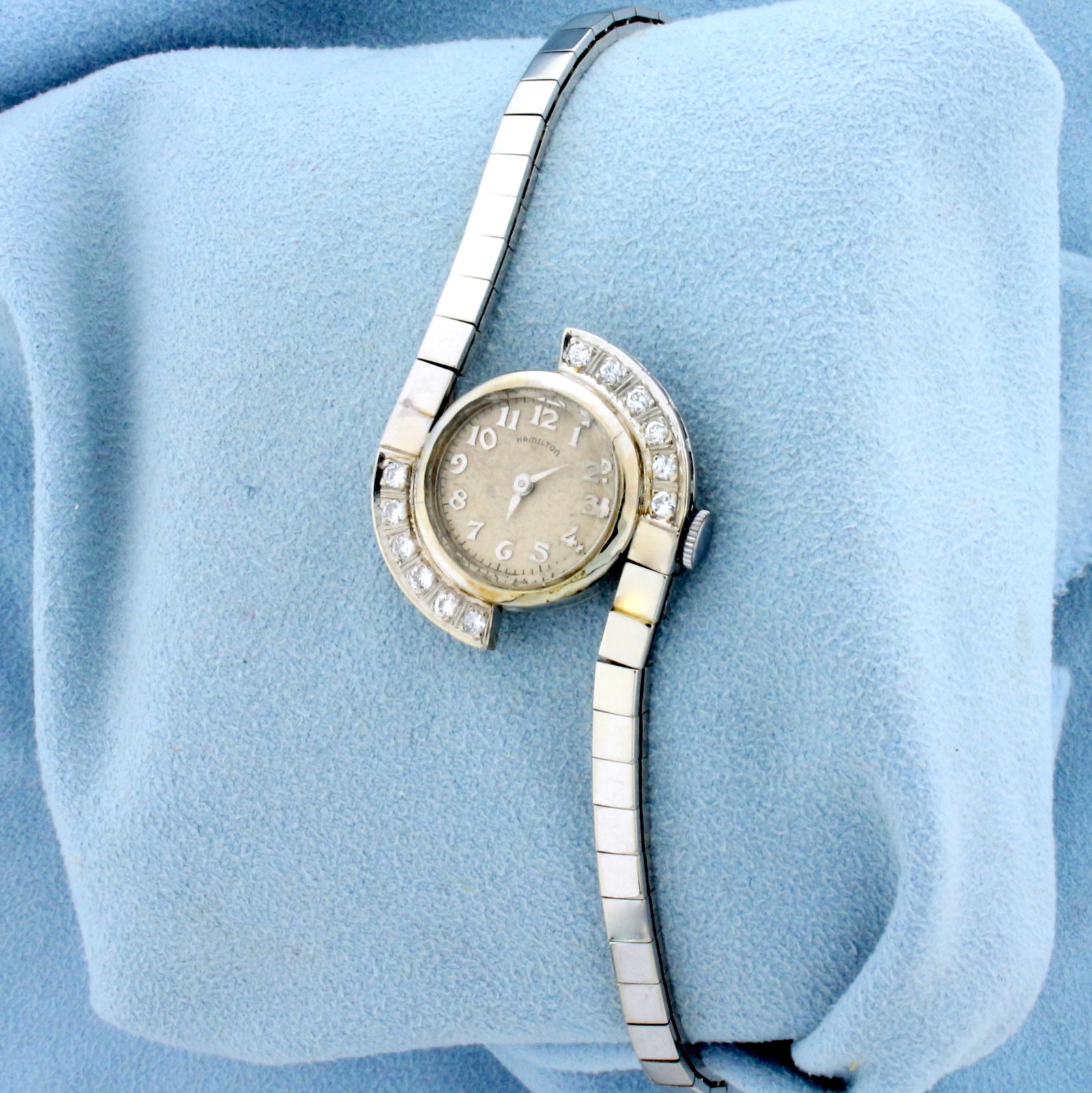 Vintage Diamond Hamilton Wind Up Watch in Solid 14K White Gold: Band and Case In Solid 14K White Gold. 32 Jewel Windup movement runs great. Contains twelve high quality Diamonds, 1/3ct TW, SI clarity/G color. 7 1/4 inches long, with safety chain. Mid century moder