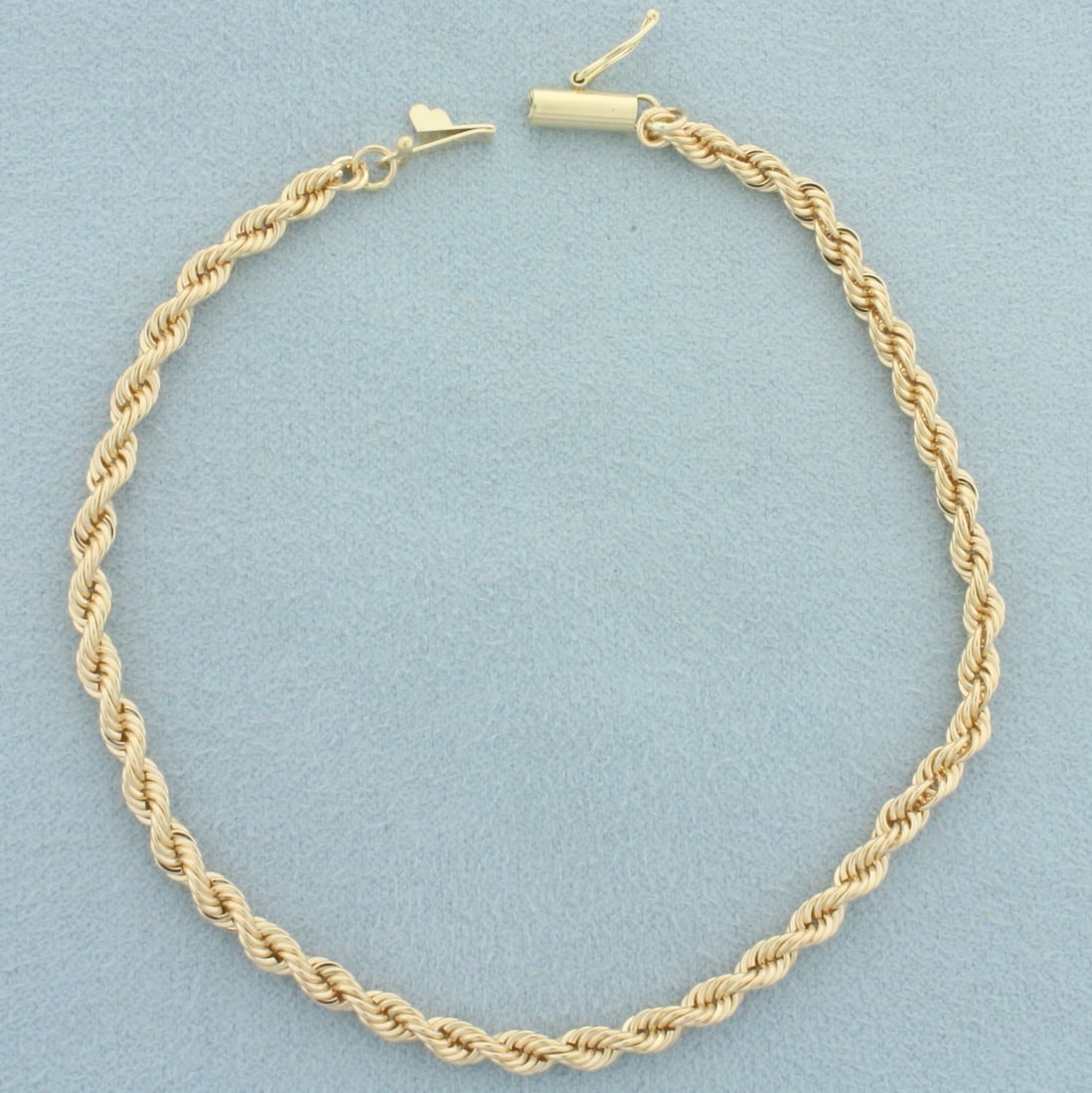 Rope Link Bracelet in 14k Rose Gold: In 14k rose gold. 8 1/4 inches long and 3.1mm wide. Barrel safety clasp. 7.4g.