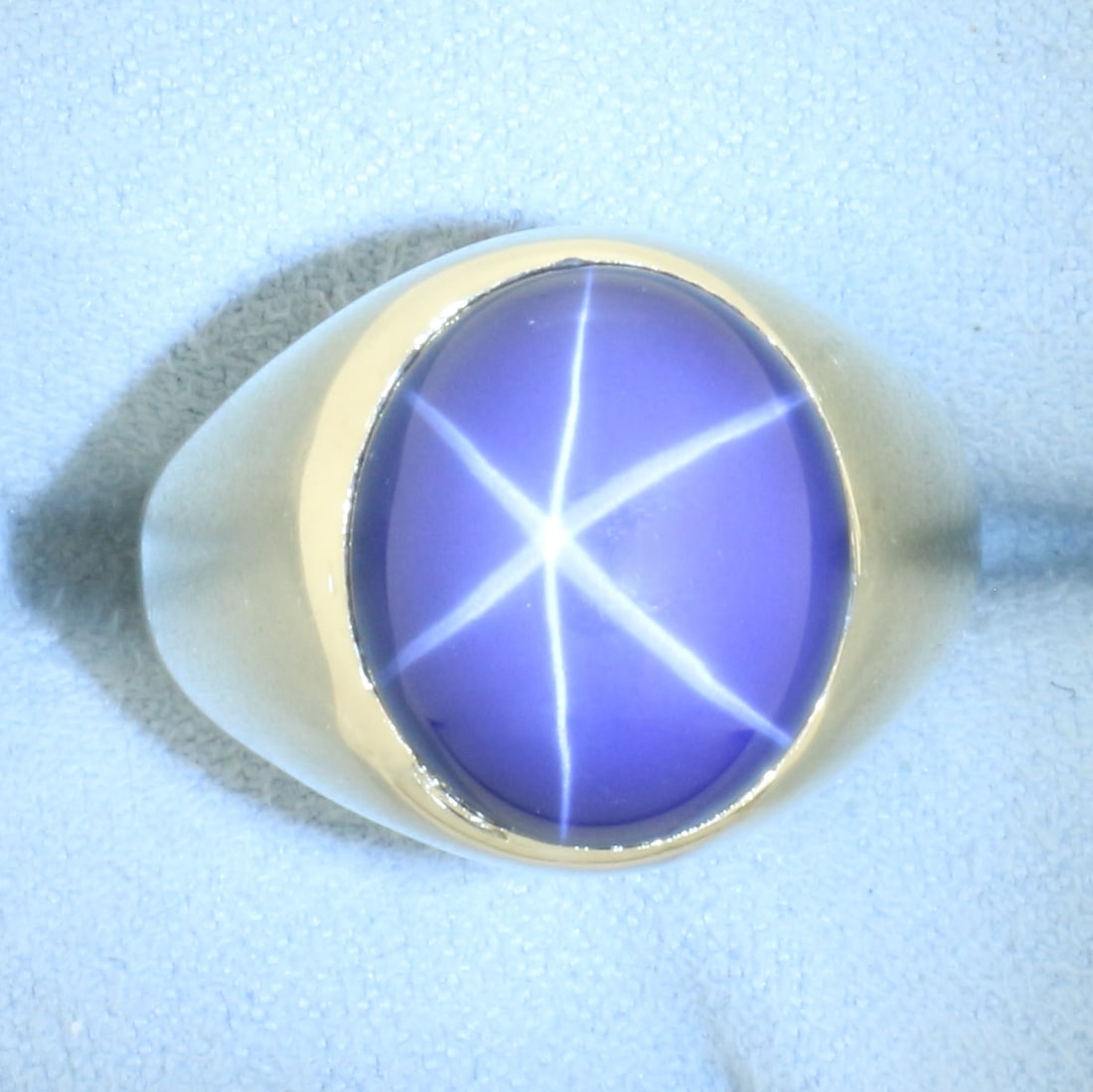 Mens Star Sapphire Ring in 14k Yellow Gold: In 14k yellow gold. Contains 1 high quality 15mmx13mm star sapphire gemstone with very distinct "star" under light. Size: 10. 8.1g.