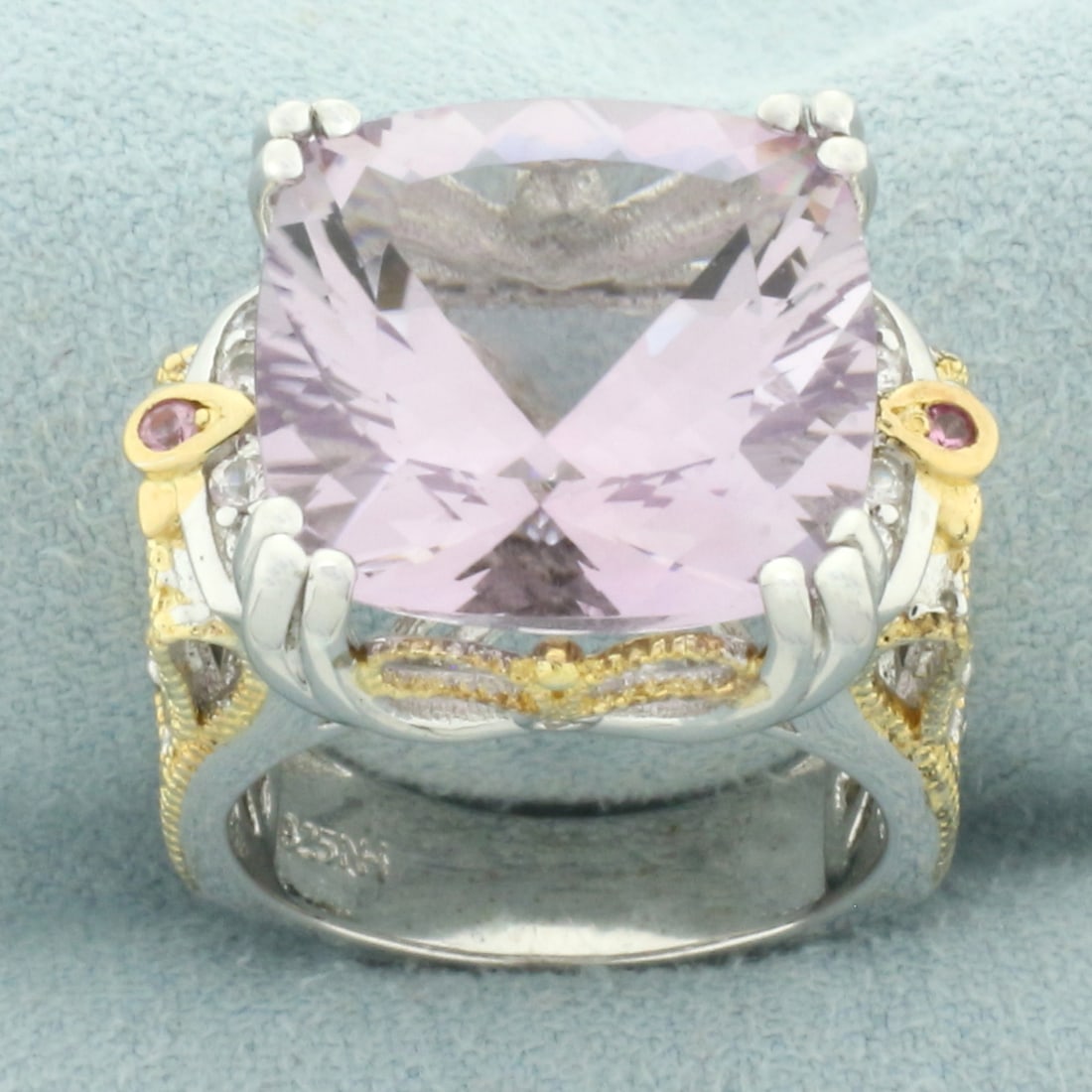 Amethyst Two Tone Filigree Ring in Sterling Silver: In .925 sterling silver. Contains 1 high quality natural fancy cushion cut 15mm Amethyst gemstone with bright color and excellent clarity Also contains 2 high quality 1mm amethyst gemstones and 8 high