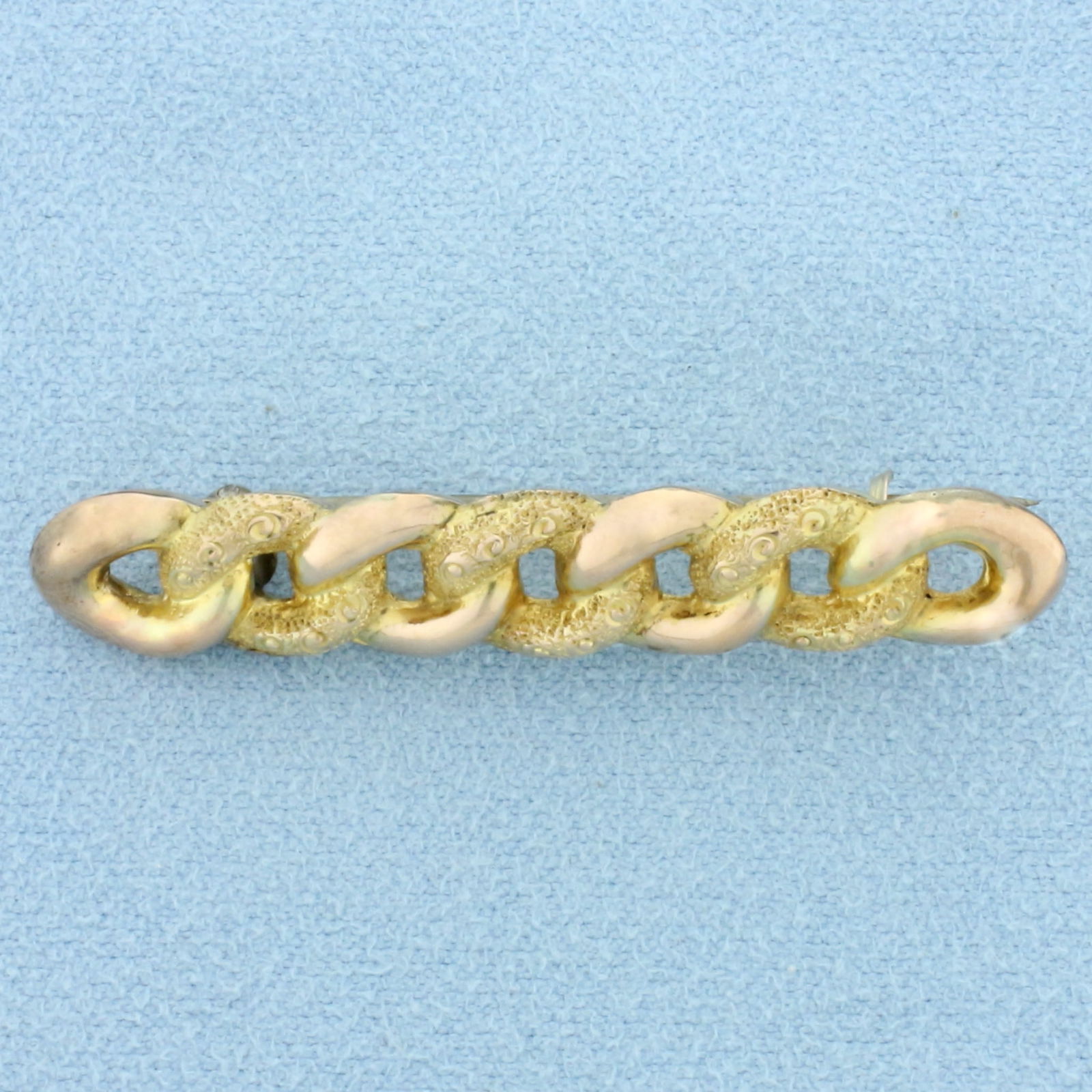 Antique Victorian Curb Link Pin in 9K Yellow and Rose Gold: In 9K Yellow and Rose Gold. 1 3/4 inches long, 9mm wide. Hallmarked English 1899 or earlier. Intricate hand detail with chased yellow gold. 1.9g.