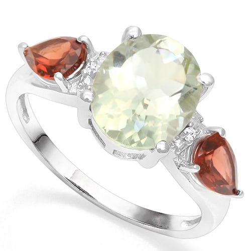 Green Amethyst, Garnet, and Diamond Ring in Sterling Silver: Platinum over sterling silver. Contains one 8x10mm oval cut green amethyst gemstone with light green color and excellent clarity. Accented with 2 pear cut garnet gemstones and 2 genuine diamonds, .01c