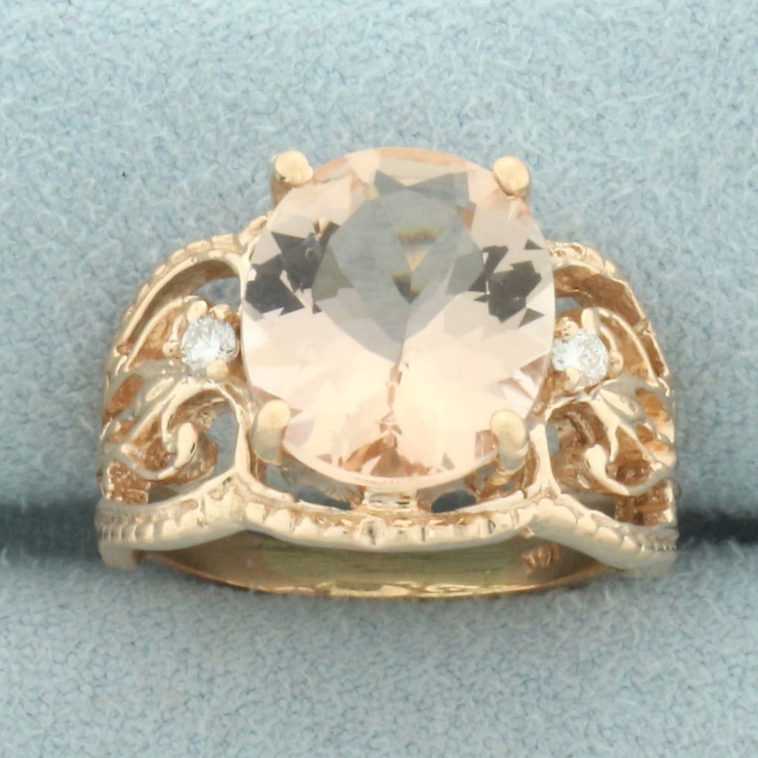 Morganite and Diamond Filigree Cut Out Ring in 14k Rose Gold: In 14k rose gold. Contains 1 high quality natural 12mm by 10mm Morganite gemstone, approximately 5cts, with beautiful salmon color and excellent clarity. Also contains 2 high quality .03ct diamonds, S