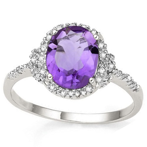 4CT Oval Amethyst & Diamond Halo Statement Ring in Sterling Silver: Platinum over sterling silver. Contains one oval cut 4.3CT amethyst gemstone with excellent color and clarity. Accented with 2 genuine diamonds, .01ctw. Size 7. 2.6g