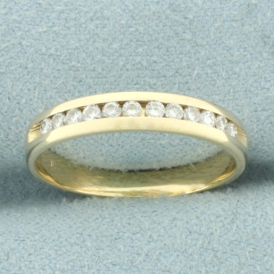 Diamond Anniversary or Wedding Band Ring in 14k Yellow Gold: In 14k yellow gold. Contains twelve high quality diamonds, 1/4ct TW, SI clarity/H color. 3.5mm at widest point. Size: 6.5. 2.2g.