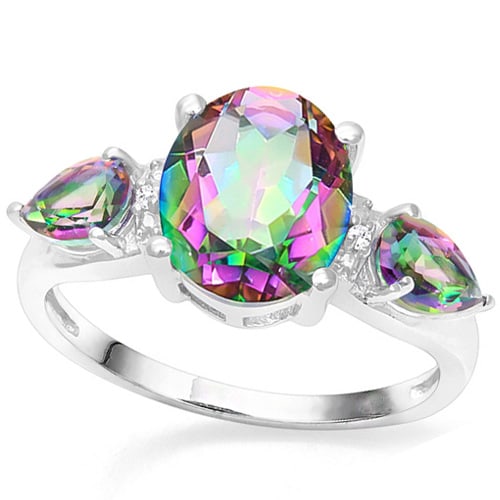 Over 3CT Mystic Topaz & Diamond Ring in Sterling Silver: In platinum over sterling silver. Contains one oval cut 8x10mm Mystic Topaz gemstone flanked by two 4x6mm pear cut mystic topaz gems. Accented with 2 diamonds, .01ctw. Size 7. 2.8g