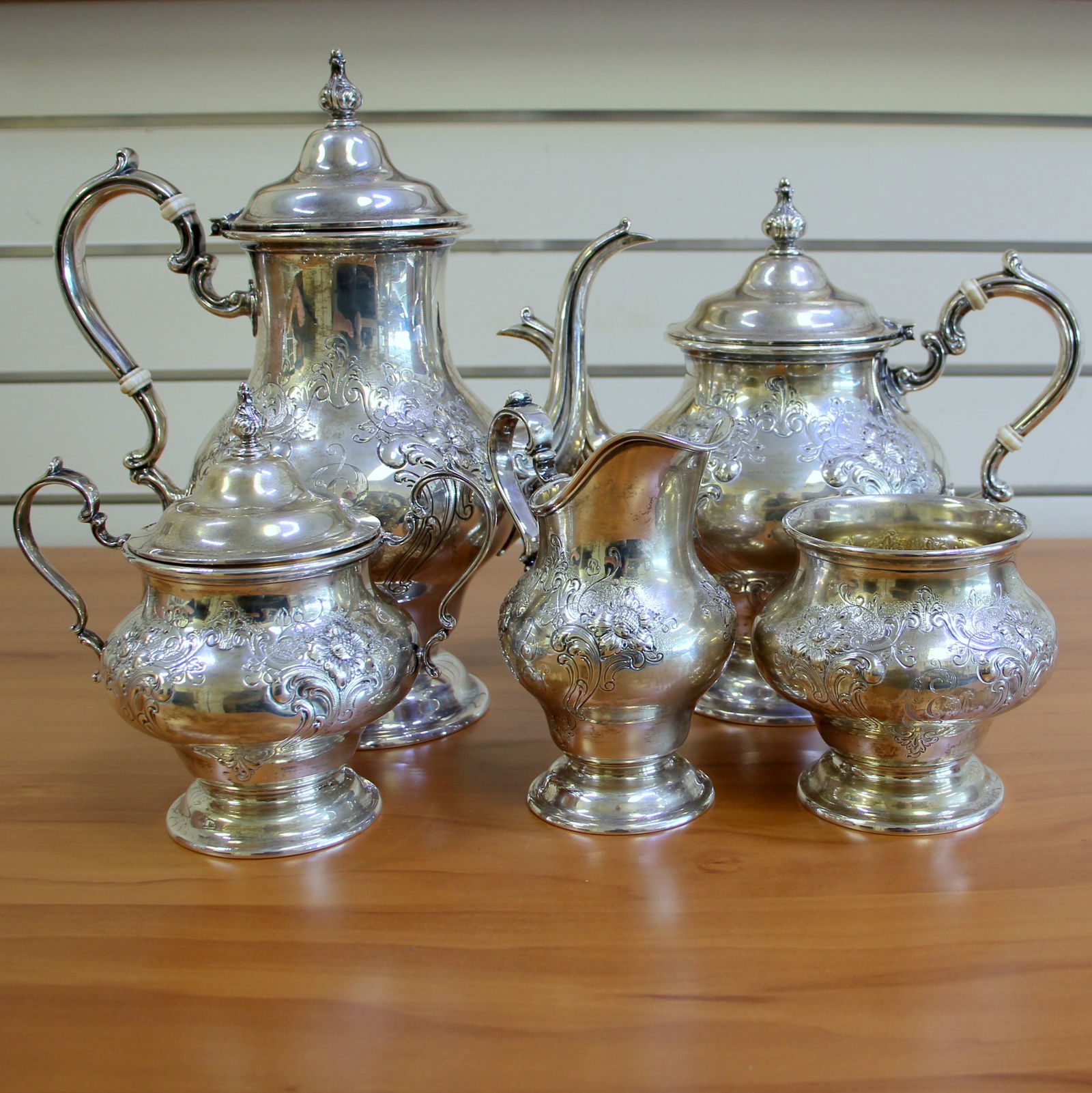 Gorham Victorian Sterling Silver 5-Piece Tea Coffee Set with Chased Flower Design: .925 Sterling silver. Gorham Pattern #1004. Victorian chased flower design with "C" monogram. 1 Coffee pot with lid-11 inches (1001/1), 3 pint. 1 Teapot with lid-9 inches (1002/1), 2 3/4 pint. 1 sugar