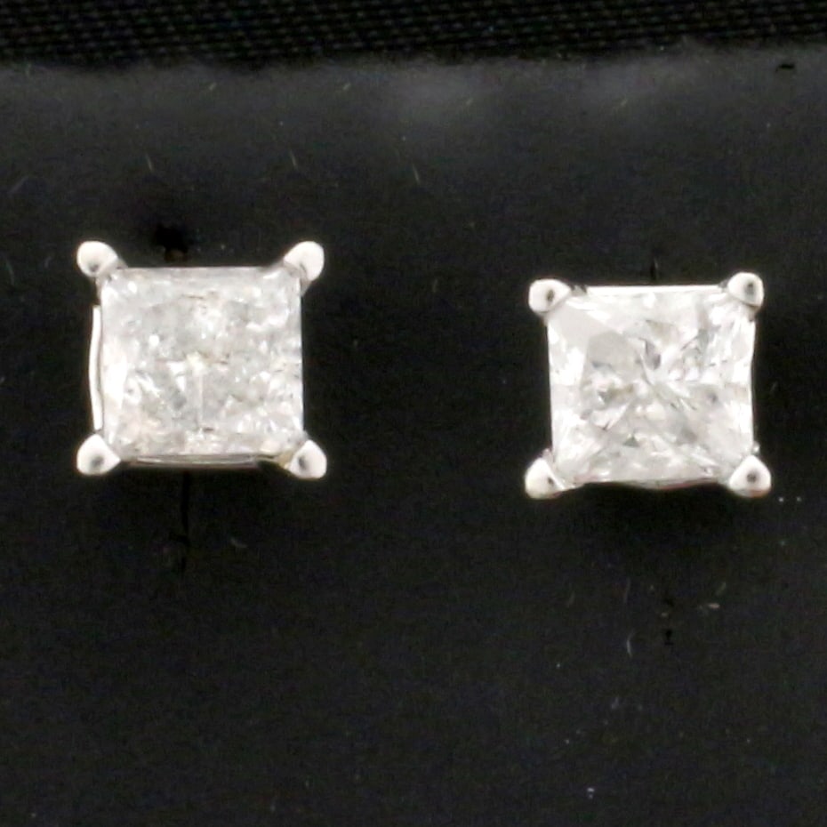 1ct TW Princess Cut Diamond Stud Earrings in 14K White Gold: In 14K White Gold. 4 prong basket setting. Contains two high quality diamonds, 1ct TW, G color/I clarity. Screw backs for added safety. 1.1g.