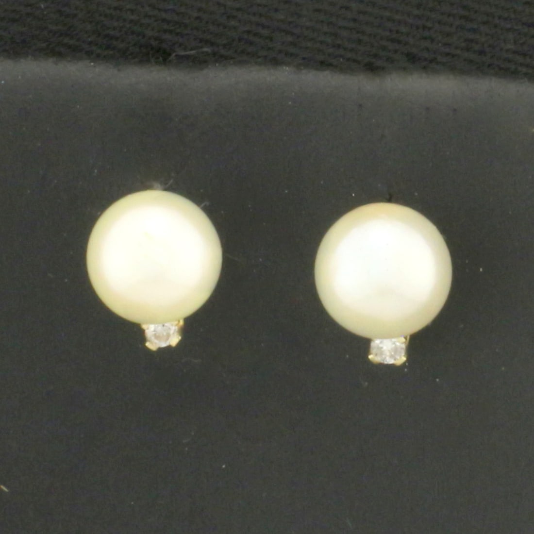 Cultured Akoya Pearl and Diamond Stud Earrings in 14k Yellow Gold: In 14k yellow gold. Contains two high quality 6.2mm cultured Akoya pearls with high luster. Also contains two high quality .02ct diamonds, H color/I clarity. Friction backs. .9g.