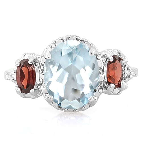 Aquamarine, Garnet, & Diamond Ring in Sterling Silver: Platinum over sterling silver. Contains one oval cut 1.5ct aquamarine gemstone with light aqua color and excellent clarity. Accented with 2/3ctw oval cut garnet gemstones and .01ctw diamond. Size 7. 2