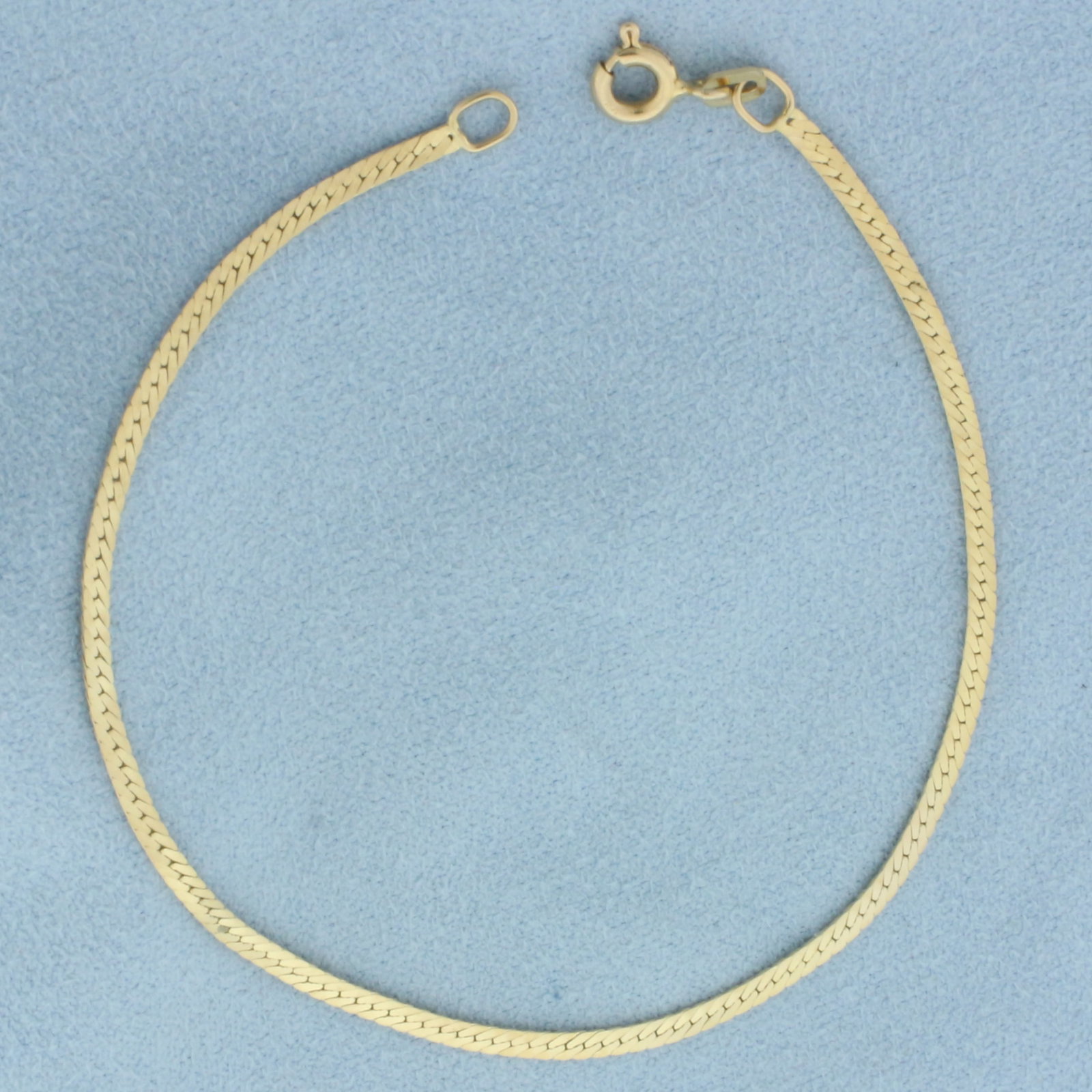 7 Inch Herringbone Link Bracelet in 14k Yellow Gold: In 14k yellow gold. 7 inches long and 1.8mm wide. Spring clasp. 1.5g.
