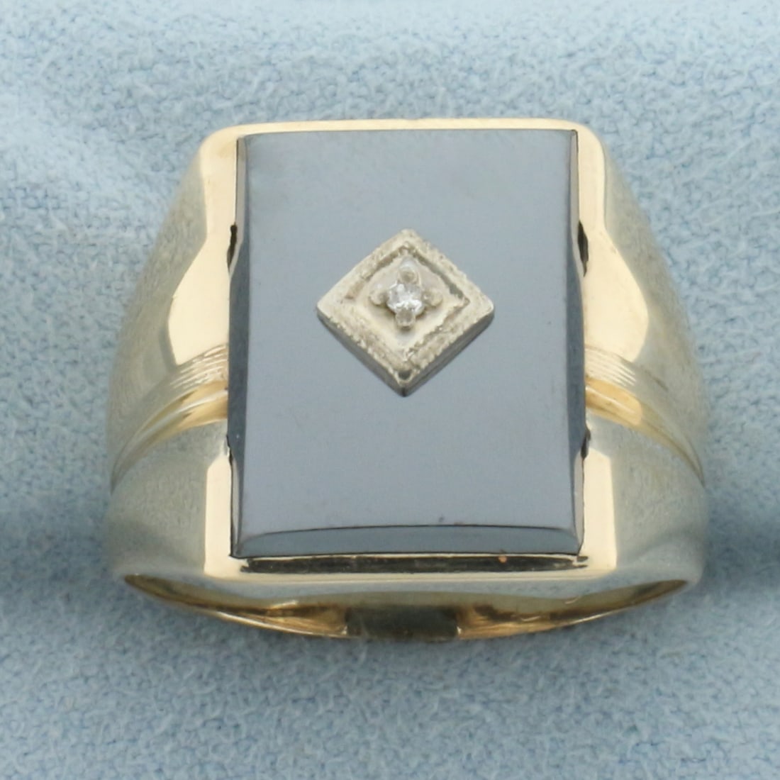 Mens Hematite and Diamond Signet Ring in 10k Yellow Gold: In 10k yellow gold. Contains one high quality .0ct diamond. Also contains one high quality hematite plaque, 15x11x2.6mm. 17mm wide at top. Size: 9. 6.0g.