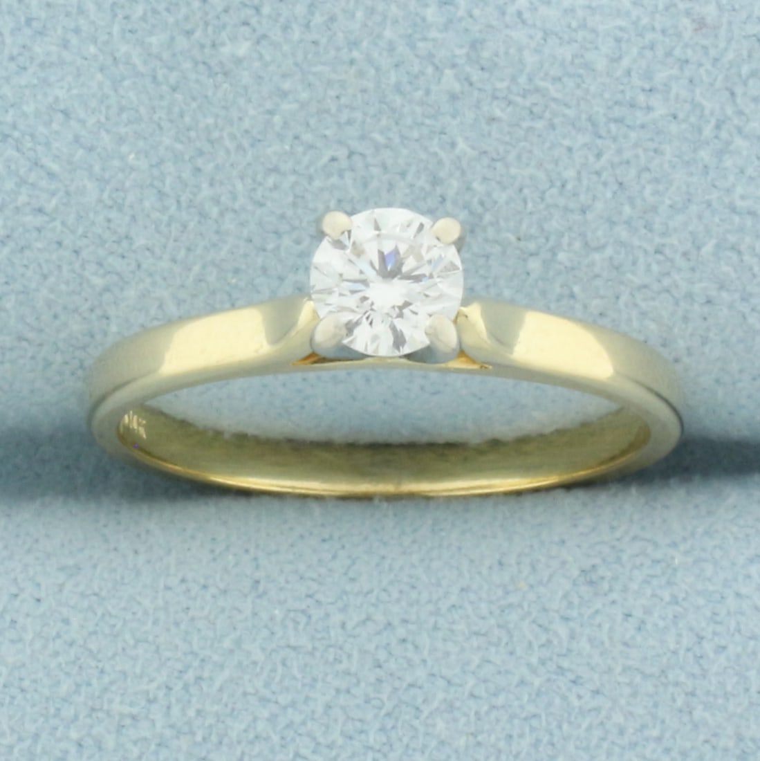 Diamond Solitaire Engagement Ring in 14k Yellow Gold: In 14k yellow gold. Contains one high quality .4ct round brilliant diamond, SI clarity/G color, great cut for lots of sparkle, eye clean. Size: 7. 2.3g.