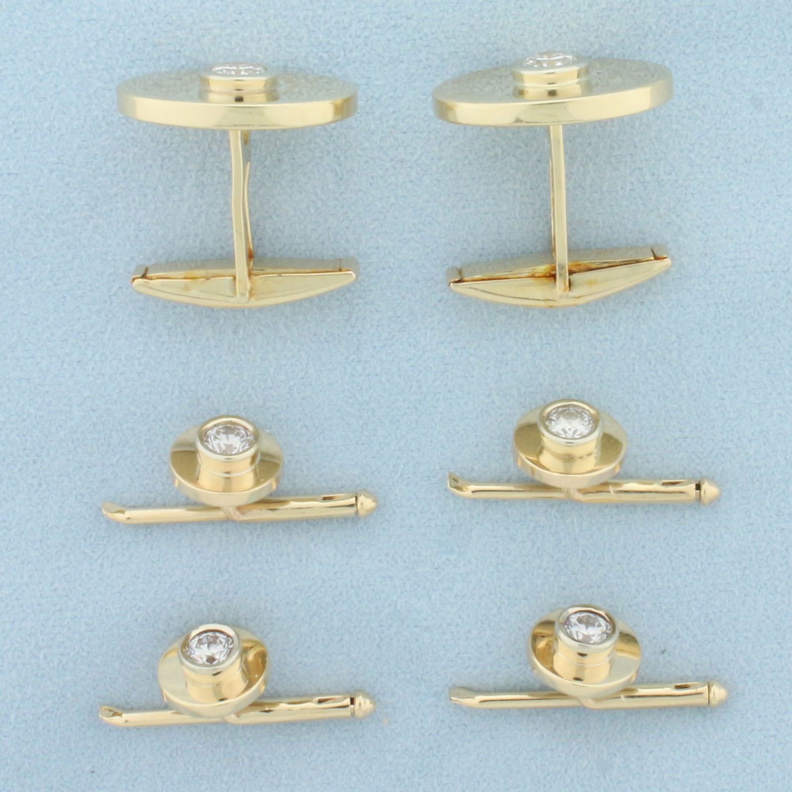 Diamond Cufflinks and Stud Set in 14k Yellow Gold: In 14k yellow gold. Cufflinks contains two high quality 2/3ct round brilliant cut diamonds, SI clarity/H color. Studs contain four 1/3ct round brilliant cut diamonds, SI clarity/H color. Cufflinks: 13