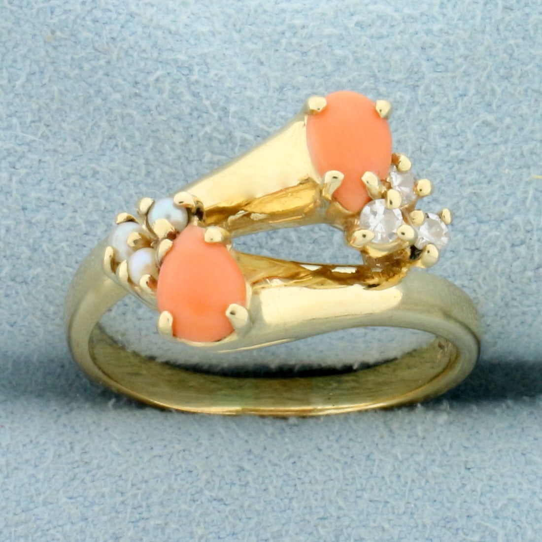 Pink Coral, Pearl and Diamond Ring in 14K Yellow Gold: In 14K Yellow Gold. Contains two high quality natural 6x4mm pear shape Pink Coral gemstones with beautiful pastel pink color. Also contains three high quality 2mm seed pearls and three high quality .0