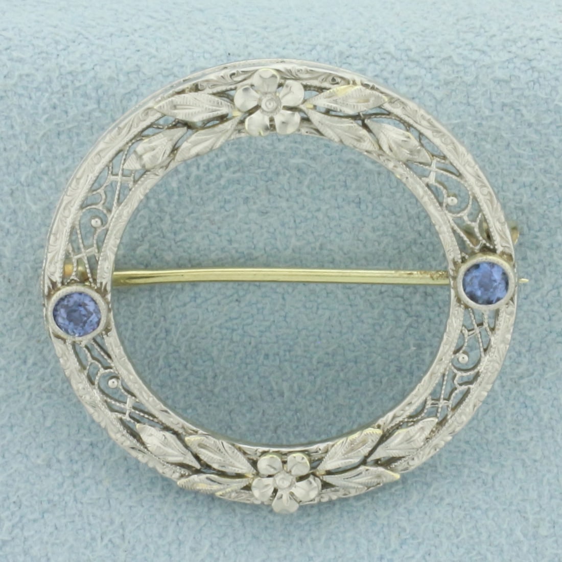 Antique Art Deco Filigree Sapphire Circle Pin in 14k White Gold: In 14k white gold. Contains two high quality natural 3mm Old European Cut Sapphire gemstones, with vibrant color and excellent clarity. 1 1/6 inch diameter. 3.4g.