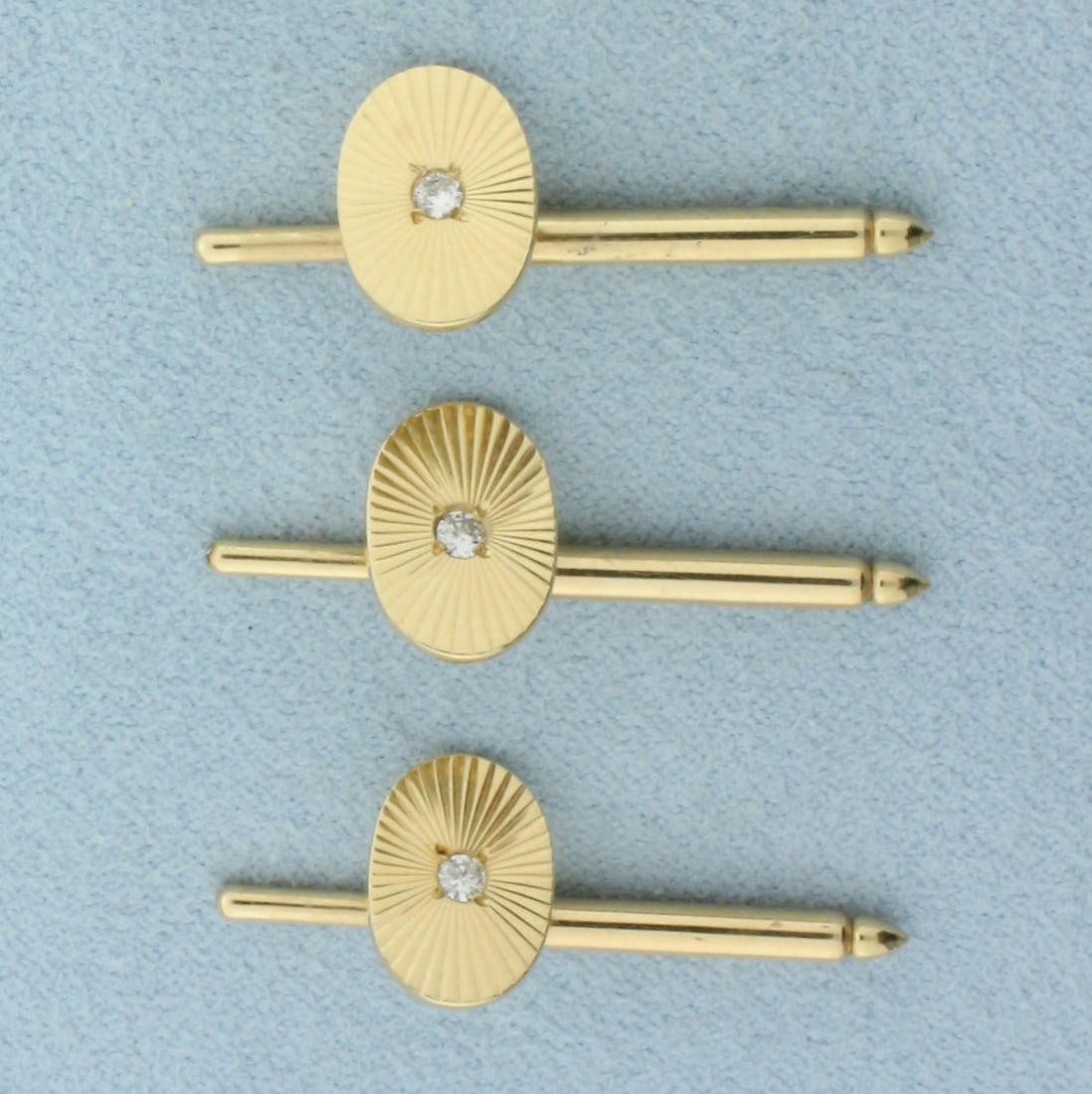 Diamond Tuxedo Studs Set in 14k Yellow Gold: In 14k yellow gold. Each stud contains one high quality .05ct SI clarity/H color. Measures 1 1/8 inch long by 1/2 inch wide. 5.3g.