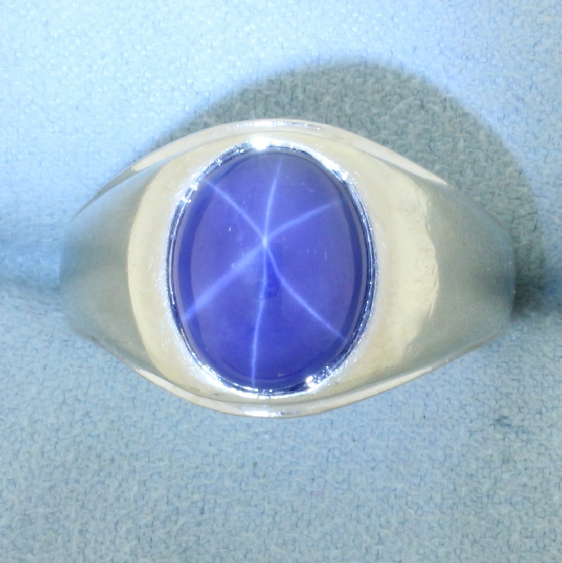 Mens Star Sapphire Ring In 14k White Gold: In 14k white gold. Contains one 12mm by 10mm high quality star sapphire gemstone with very distinctive star under light. Size 10.5. 14.5g.