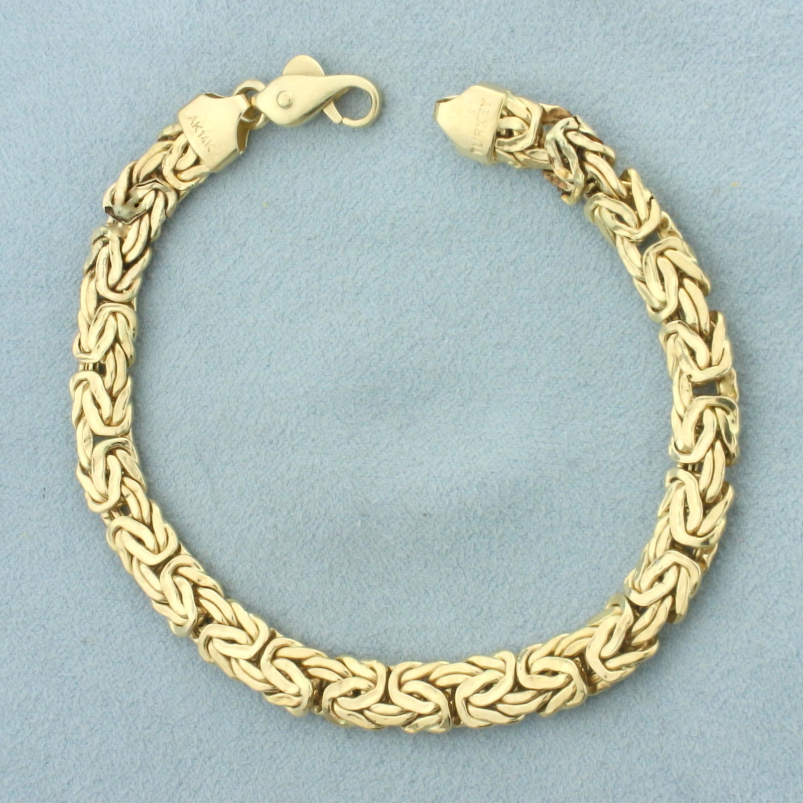 Byzantine Link Bracelet in 14k Yellow Gold: In 14k yellow gold. 7 5/8 inches long and 7mm wide. Lobster clasp. 8.6g.