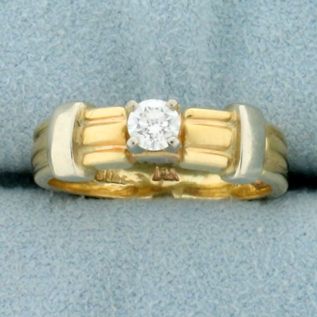Vintage Solitaire Engagement Ring in 14K Yellow and White Gold: In 14K Yellow and White Gold. Contains a high quality .2ct round brilliant cut Diamond, SI clarity/H color, completely eye clean and great cut for lots of sparkle. Size 6 3/4. 4.5g