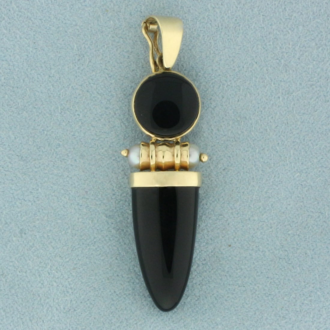 Onyx and Pearl Pendant in 14k Yellow Gold: In 14k yellow gold. Contains one 19mm and one 9mm high quality onyx gemstones. Also contains two high quality3.6mm cultured pearls with high luster. Bale has latch that opens to easily attach to a cha