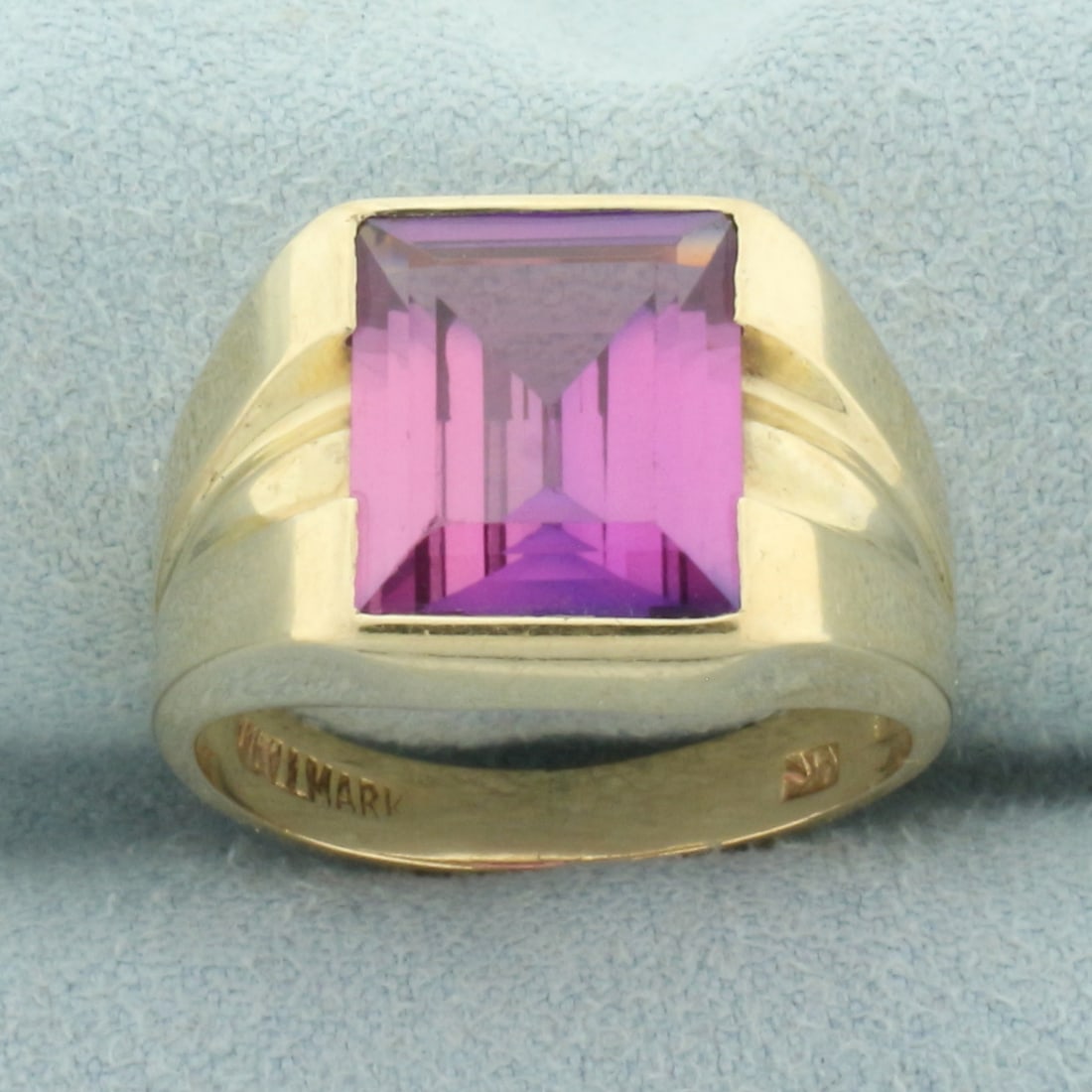 Lab Pink Sapphire Ring in 10k Yellow Gold: In 10k yellow gold. Contains 1 high quality rectangular step cut lab pink sapphire gemstone, 12mm by 10mm, approximately 7cts, with vibrant color and excellent clarity. Size: 8.25. 6.9g.