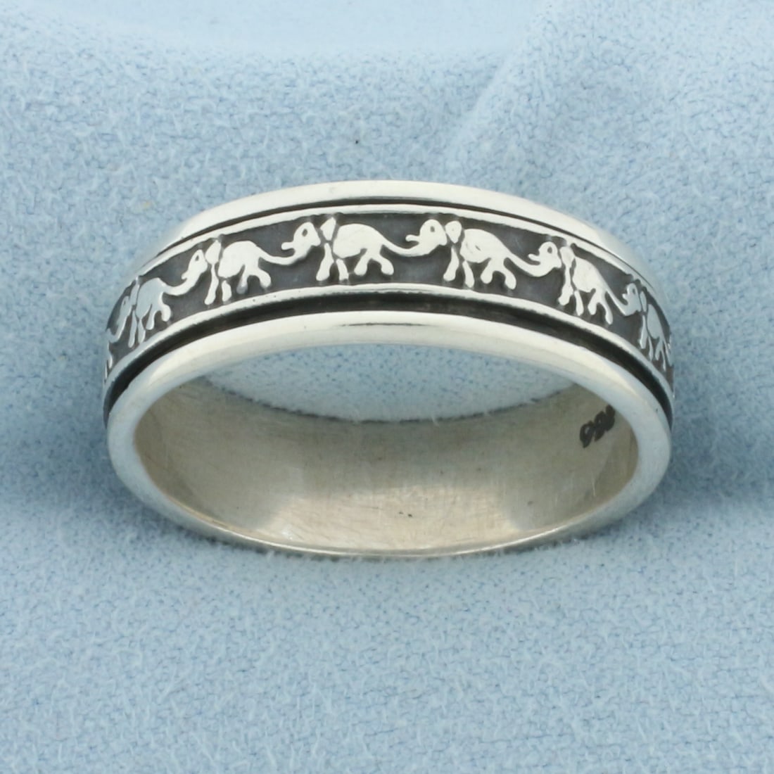 Mens Elephant Spinning Ring in Sterling Silver: In .925 sterling silver. 7.5mm wide. Inner elephant band spins within ring. Size: 13. 7.5g.