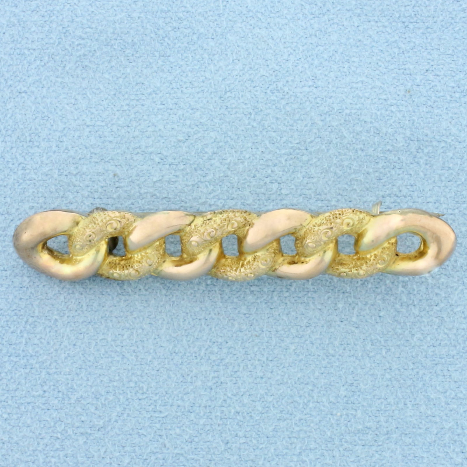 Antique Victorian Curb Link Pin in 9K Yellow and Rose Gold: In 9K Yellow and Rose Gold. 1 3/4 inches long, 9mm wide. Hallmarked English 1899 or earlier. Intricate hand detail with chased yellow gold. 1.9g.