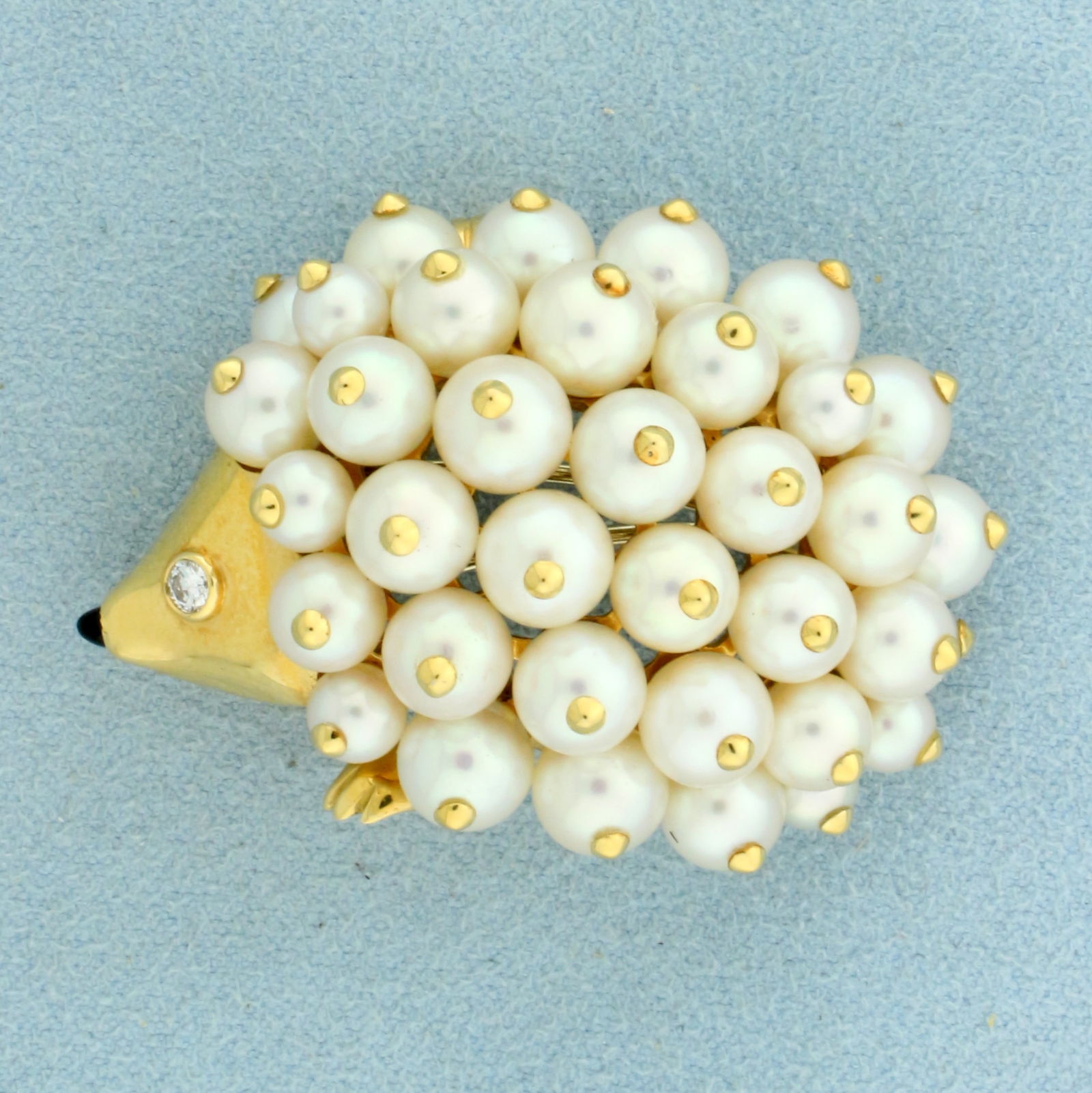 Authentic Chanel Pearl Porcupine Hedgehog Pin or Pendant or Brooch in 18K Yellow Gold: In 18K Yellow Gold. Contains thirty four high quality natural 5.5mm Pearls, with excellent color and luster. Also contains one high quality .05ct Diamond VVS clarity/F color. 1 1/4 inches long. 1 3/4