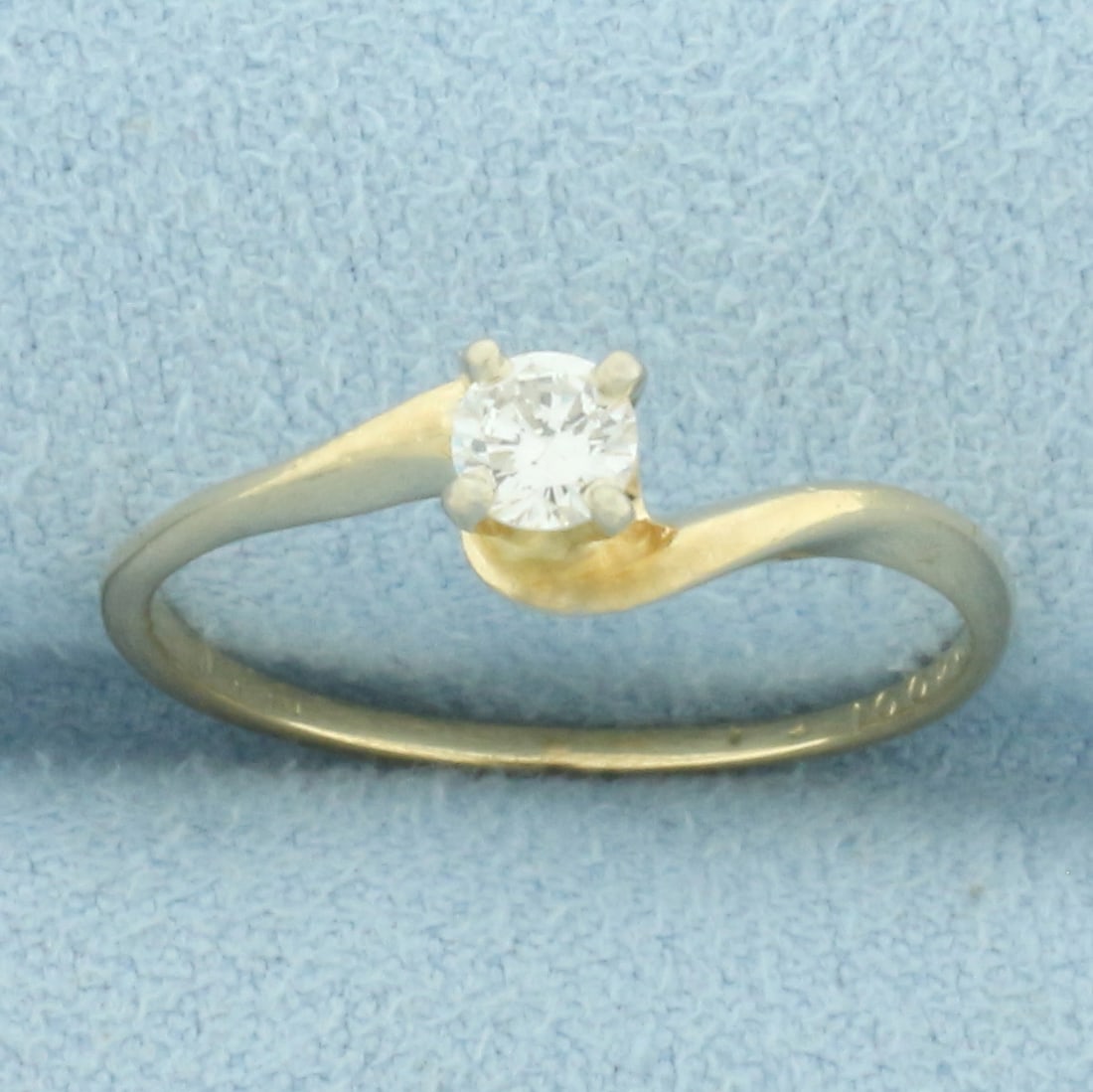 Bypass Design Diamond Solitaire Engagement Ring in 14k Yellow Gold: In 14k yellow gold. Contains one high quality 1/5ct round brilliant diamond, SI clarity/H color, eye clean, great cut for added brilliance. Size: 6.5. 1.6g.