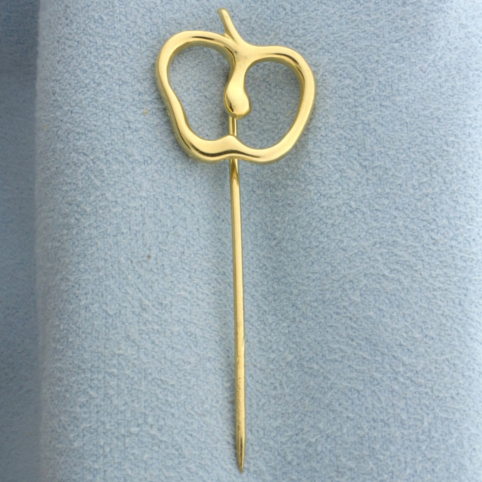 Tiffany and Co. Elsa Peretti Apple Stick Pin in 18k Yellow Gold: In 18k yellow gold. 1 7/8 inches long x 5/8 inches wide. 2.9g.