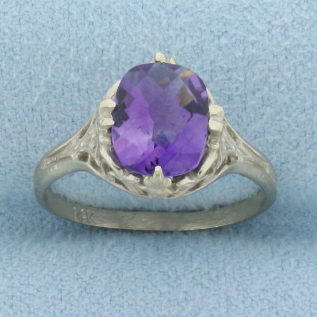 Vintage Amethyst Filigree Ring in 14k White Gold: In 14k white gold. Contains one high quality natural 9mm by 7mm checkerboard cushion cut Amethyst gemstone with intense color and excellent clarity. Size: 5. 2.0g.