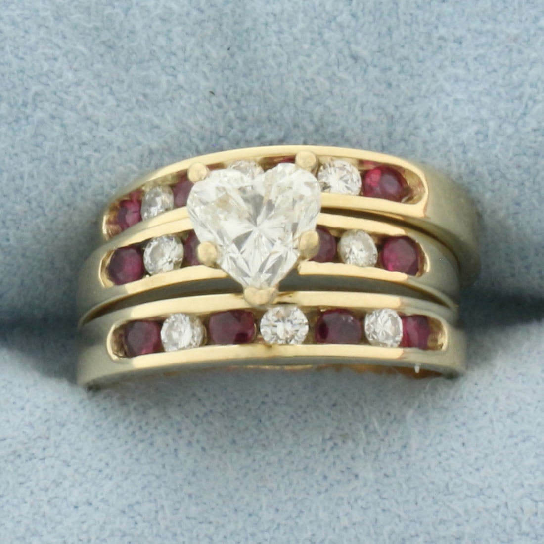 Heart Diamond and Ruby Engagement Ring and Wedding Band Ring Bridal Set in 14k Yellow Gold: In 14k yellow gold. Contains one high quality 6mm heart cut diamond, approximately 1ct, SI2 clarity/I color, eye clean. Also contains twelve high quality 2mm Ruby gemstones with intense color and exce